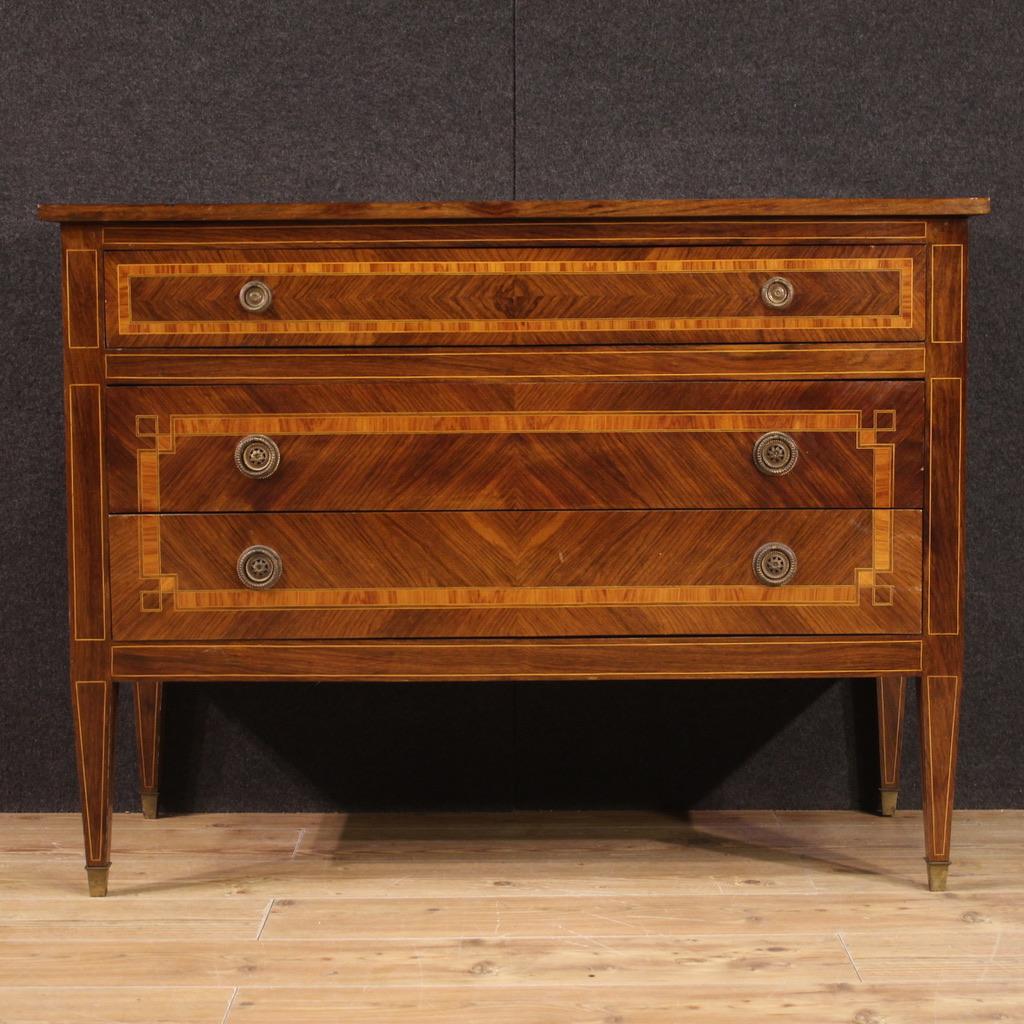Italian chest of drawers from the mid 20th century. Furniture of beautiful lines and pleasant furnishings, in Louis XVI style, finely inlaid in walnut, maple, bois de rose and ebonized wood. Chest of drawers equipped with three spacious drawers,