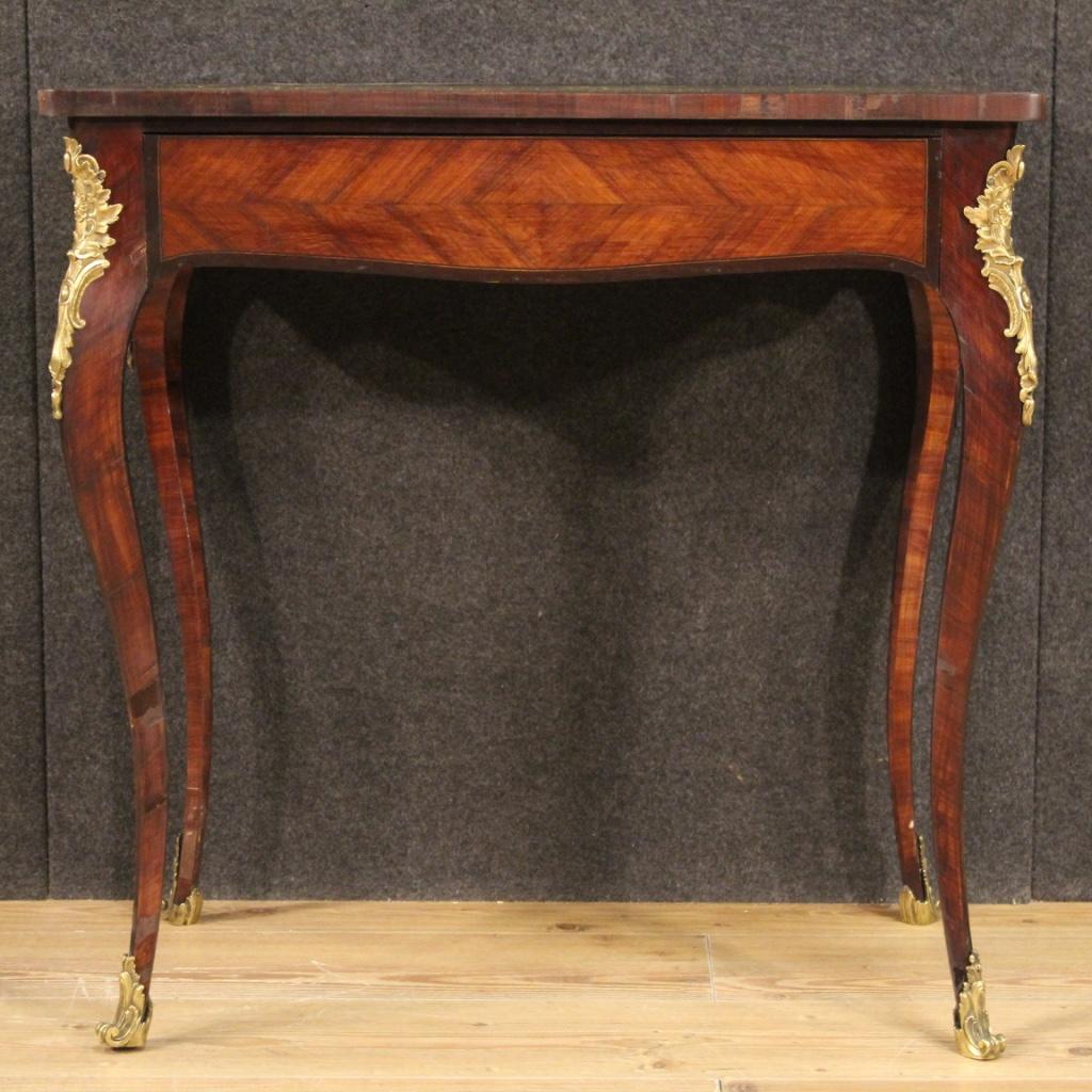 Small French writing desk from the early 20th century. Furniture finished from the center inlaid in woods of palisander, rosewood, mahogany, maple and fruitwood of beautiful line and pleasant decor. Napoleon III style coffee table richly adorned
