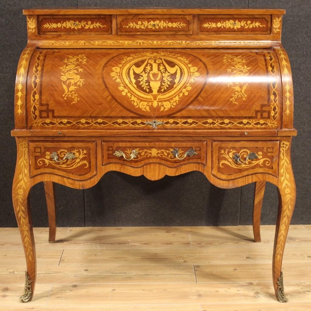 Italian roll-top bureau from 20th century. Napoleon III style furniture richly inlaid and veneered in mahogany, maple, walnut, palisander and fruitwood. Bureau equipped with six external drawers of excellent capacity, roller with extractable top