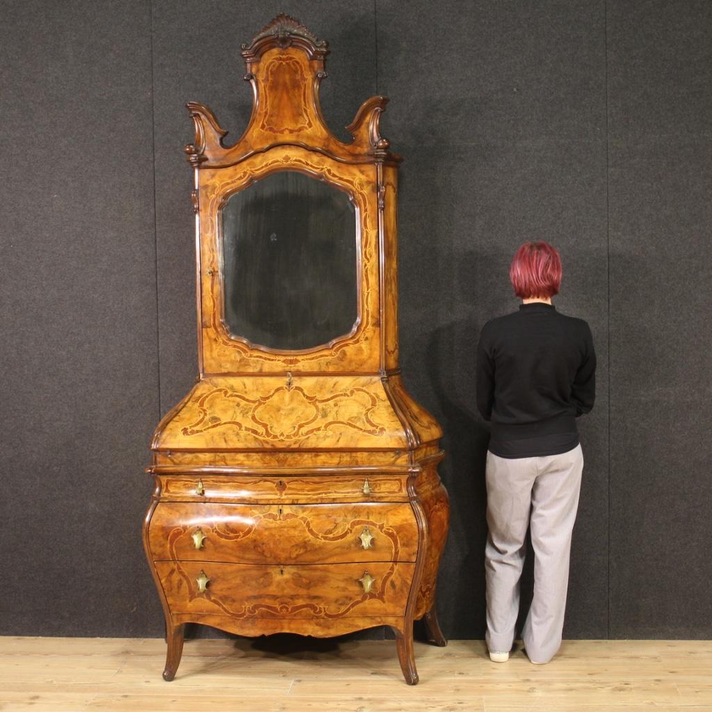 Lombard trumeau from the mid-20th century. Moved and rounded furniture in Rococo style richly inlaid in walnut, burl, maple, beech and fruitwood. Double body trumeau equipped with three large drawers and fall-front in the lower part. Interior also