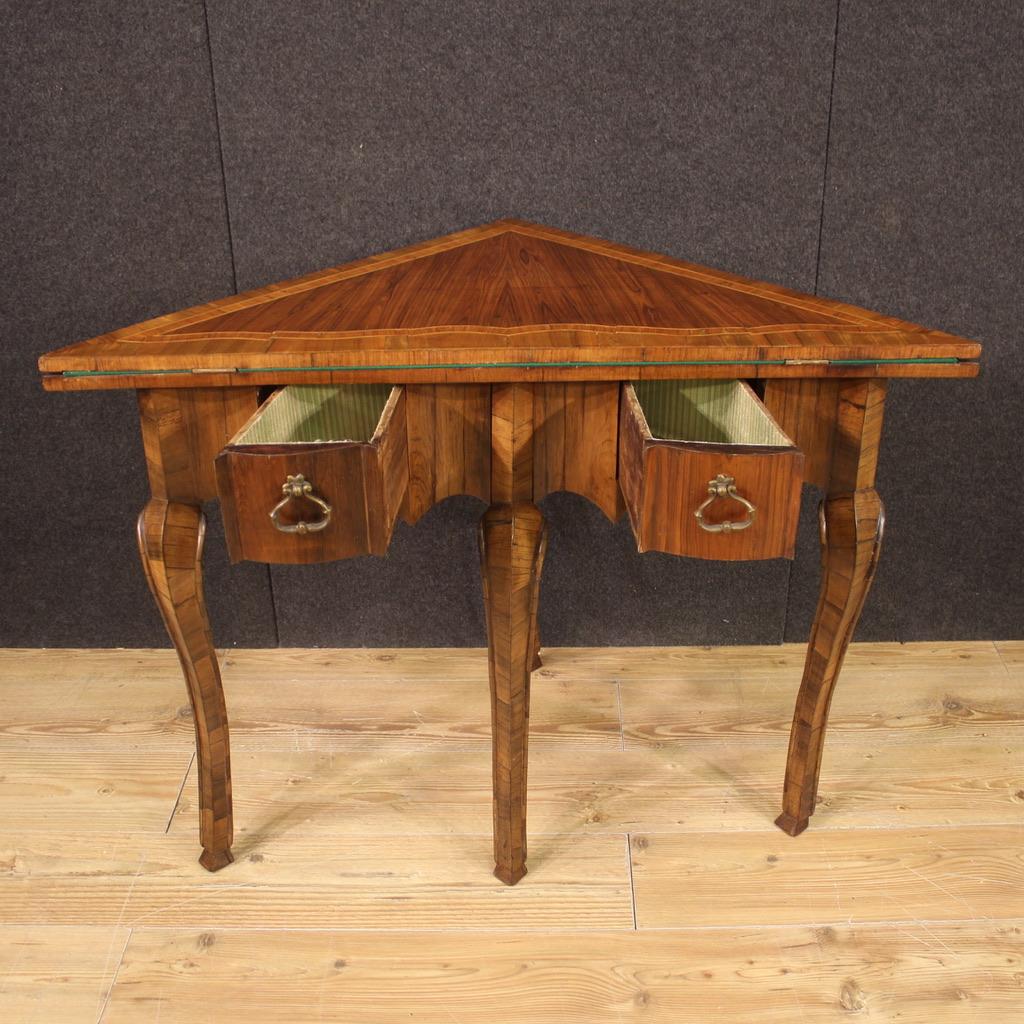 Game table corner cabinet, Veneto, mid-20th century. Carved, veneered and inlaid furniture in walnut, palisander, maple, rosewood and fruitwood. Corner cabinet with inlaid wooden top that can be opened and offers, once opened, a play surface covered
