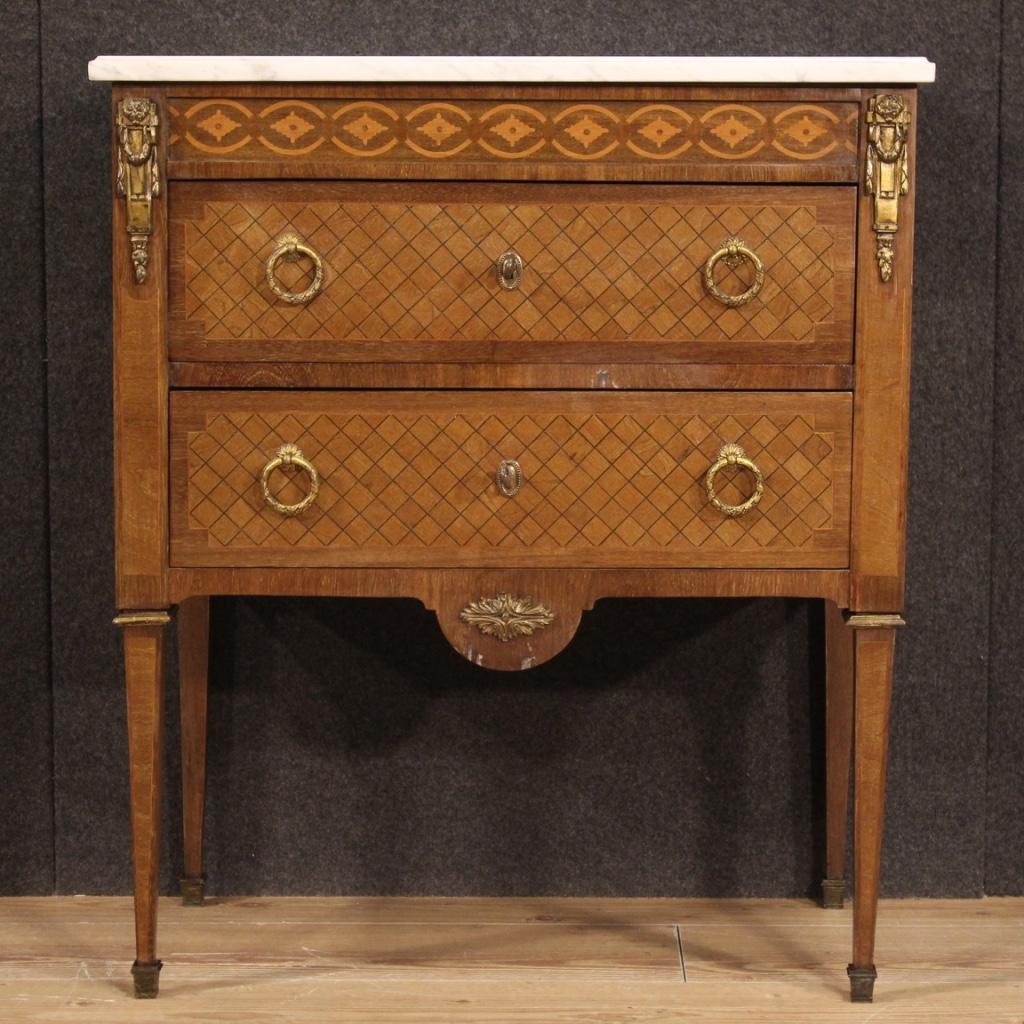 Small French dresser from the mid 20th century. Louis XVI style furniture adorned with geometric inlay in mahogany, walnut, maple and fruitwood. Commode equipped with two drawers of good capacity and top in marble of good size and service. Furniture
