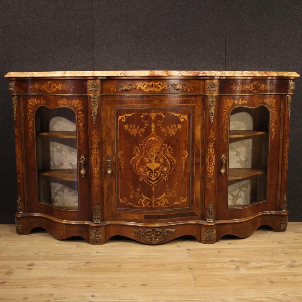 French sideboard from 20th century. Furniture in Napoleon III style richly adorned with gilded and chiseled bronze and brass. Sideboard inlaid in walnut, mahogany, burl, maple, palisander, rosewood and fruitwood with floral decorations. Cabinet with