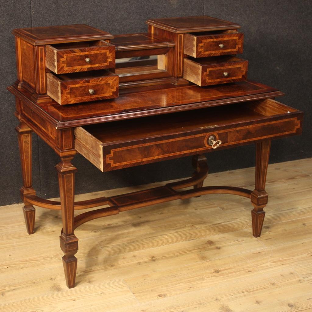 20th century French writing desk. Inlaid furniture in woods of rosewood, walnut, burl, mahogany and beech of beautiful line and pleasant furnishing. Writing desk equipped with a large frontal drawer and four small drawers in the upper part. Shelf