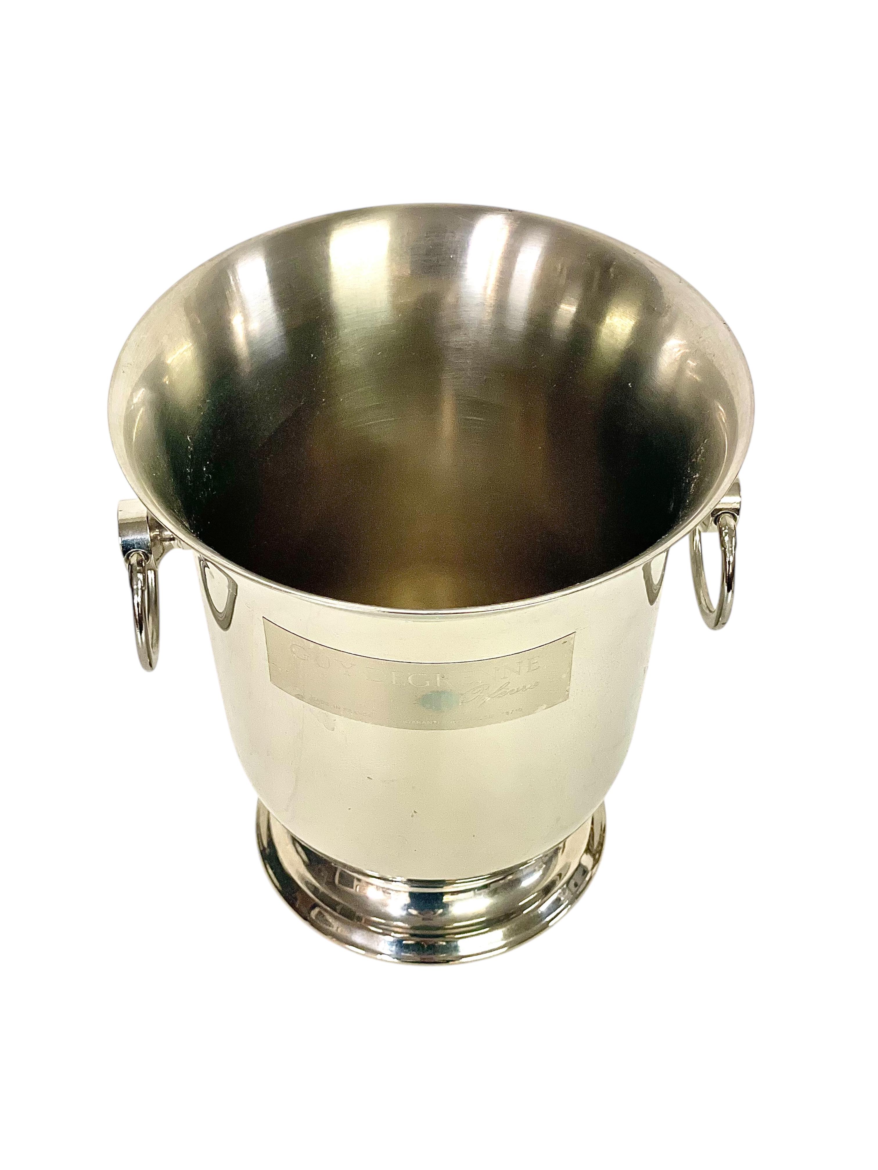 This elegant champagne bucket by Guy Degrenne reflects the high standards of French craftsmanship for which the brand is renowned. Founded in 1948 in Vire, Normandy, Guy Degrenne initially became famous for its innovative use of recycled steel from