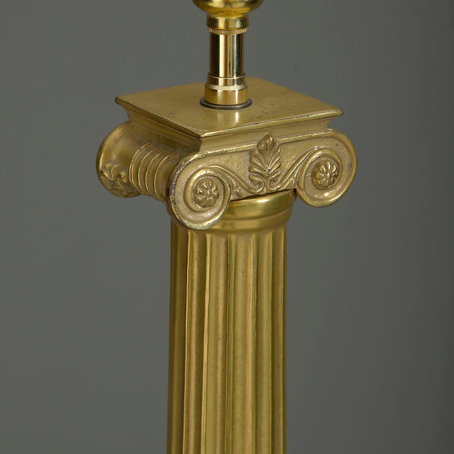 A twentieth century brass lamp base, taking the form of a fluted column with ionic capital, set upon a stepped square plinth.

Ex. U.S. Embassy London.

Dimensions refer to original brass elements only.

Wired to UK Standards. This lamp can be