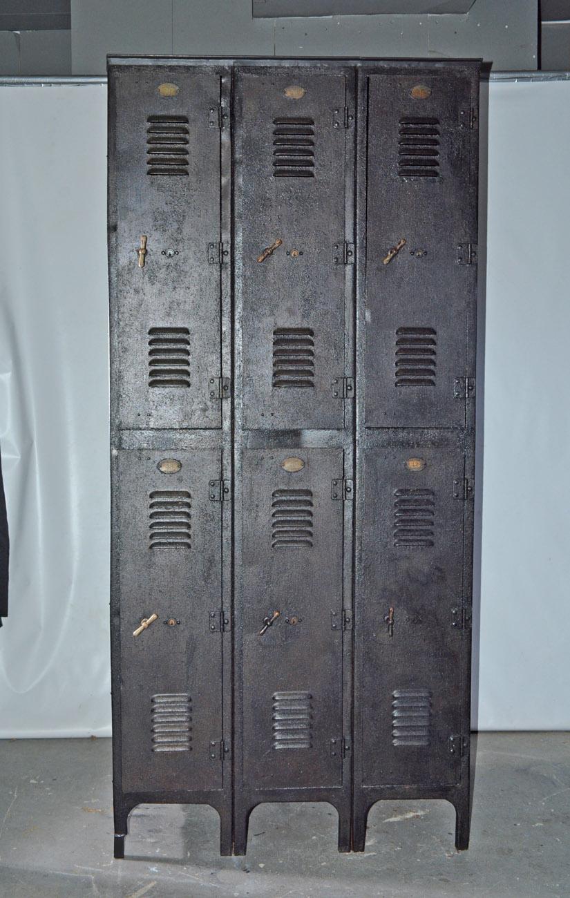 The industrial iron storage gym school locker has two stacked compartments, upper level with one shelf. Handles that turn to secure the door. Doors have air vents. A fourth complimentary unattached unit available. Great for extra storage or mudroom