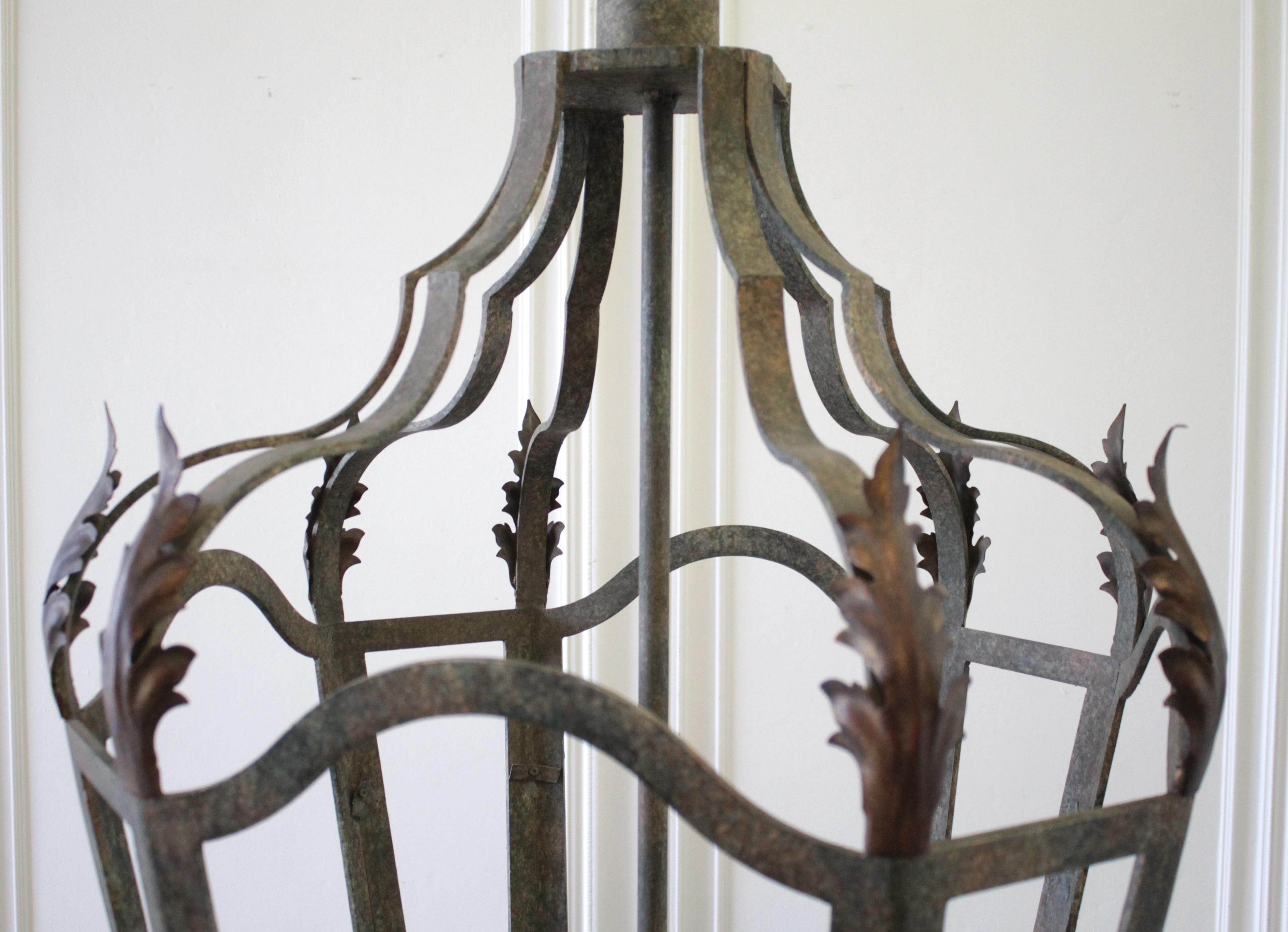 Beautiful iron lantern pendant has great patina, and decorative leaf details.
Measures: 29