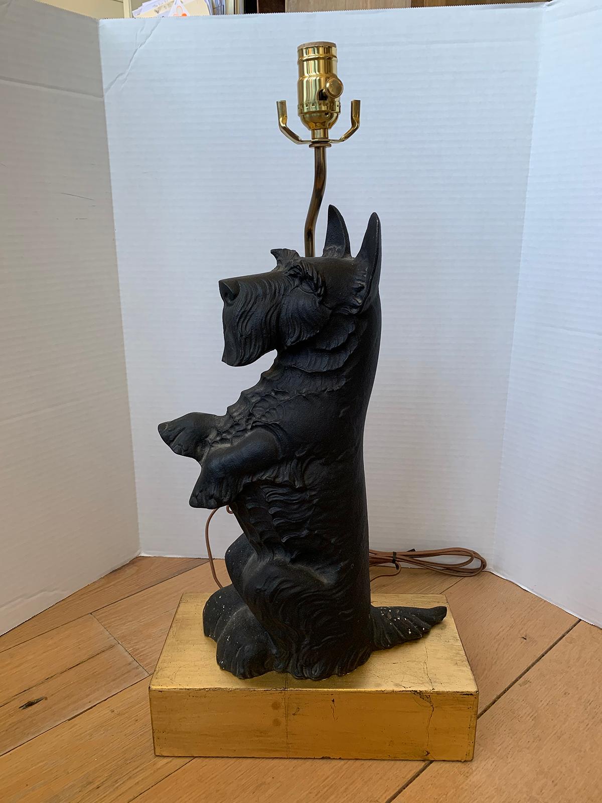 20th century iron Scottie dog as lamp on custom gilt base
New wiring.