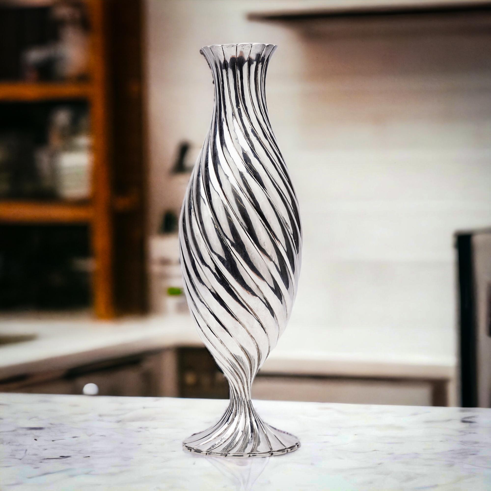 20th Century Italian 925 sterling silver torsade vase by Mario Buccellati

Made in Italy, 20th Century.
Maker: Mario Buccellati
Fully hallmarked.

Mario Buccellati was born into a family of goldsmiths, beginning with Contardo Buccellati, who