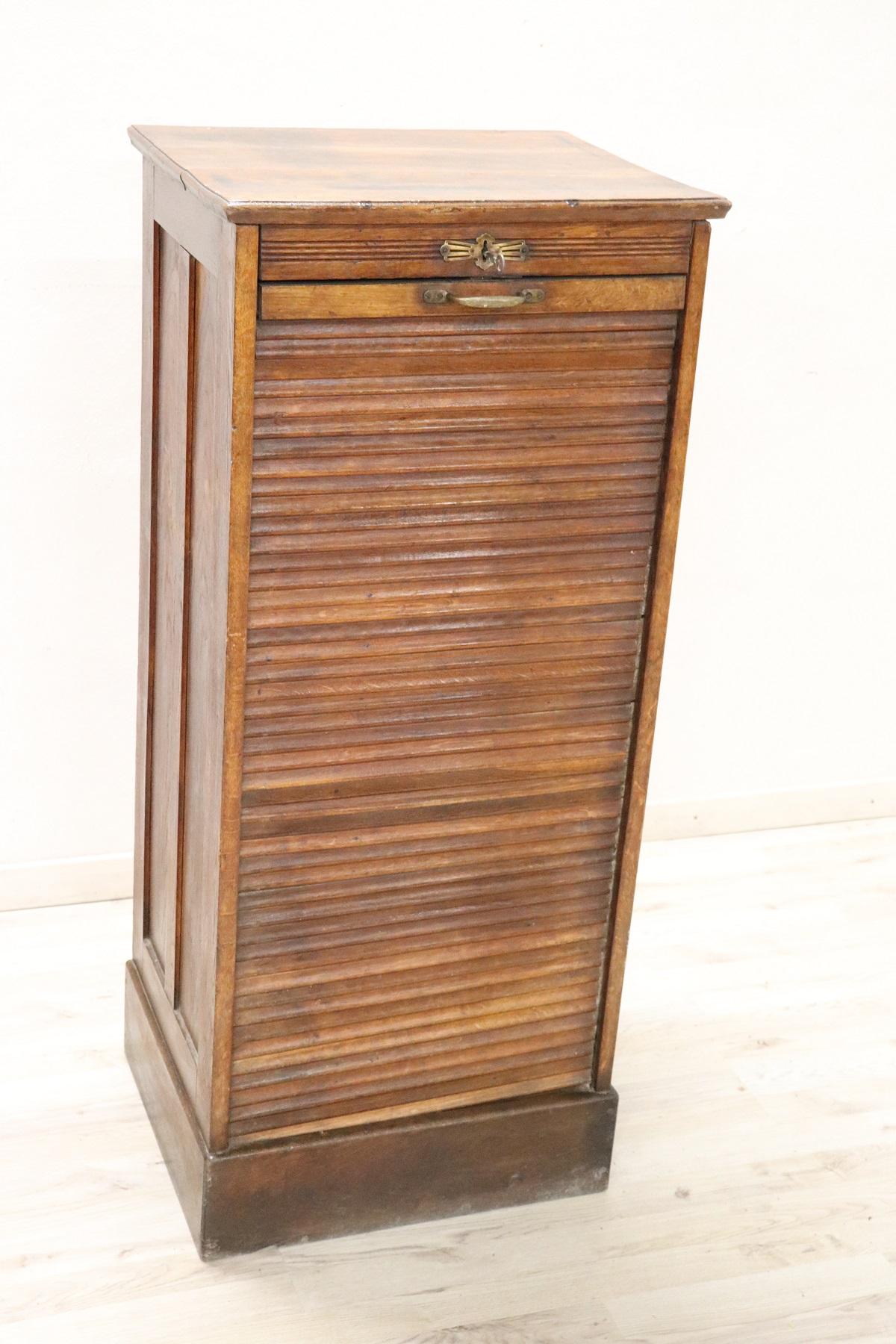 Italian cabinet, 1940s. High quality furniture in solid beechwood. The front door has a handmade sliding shutter.