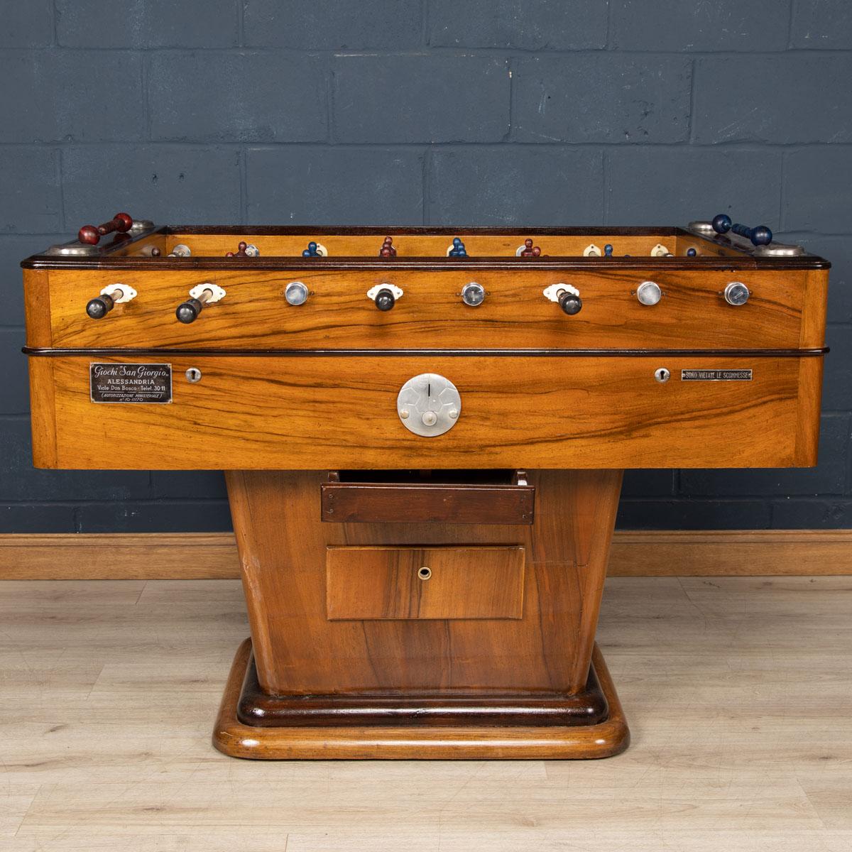 A truly striking table football table made in Italy around the middle of the 20th century.

CONDITION
In Great Vintage Condition - sympathetically restored. Nuts holding the players replaced, some crazing to the green glass playing surface where