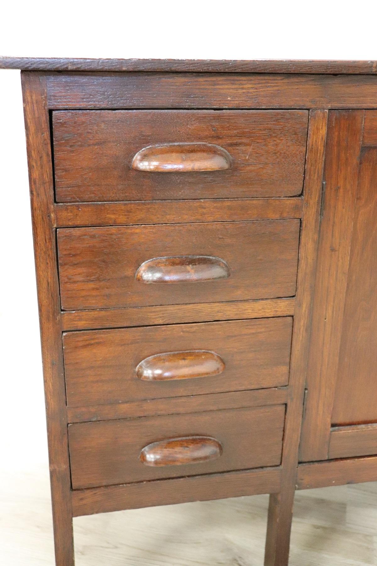 Rare Italian Art Deco buffet. Made of fine solid oakwood. All these features are typical of the 1930s Art Deco period. Small size can also be used in small rooms. Four comfortable drawers and two doors. Perfect conditions ready to be inserted in
