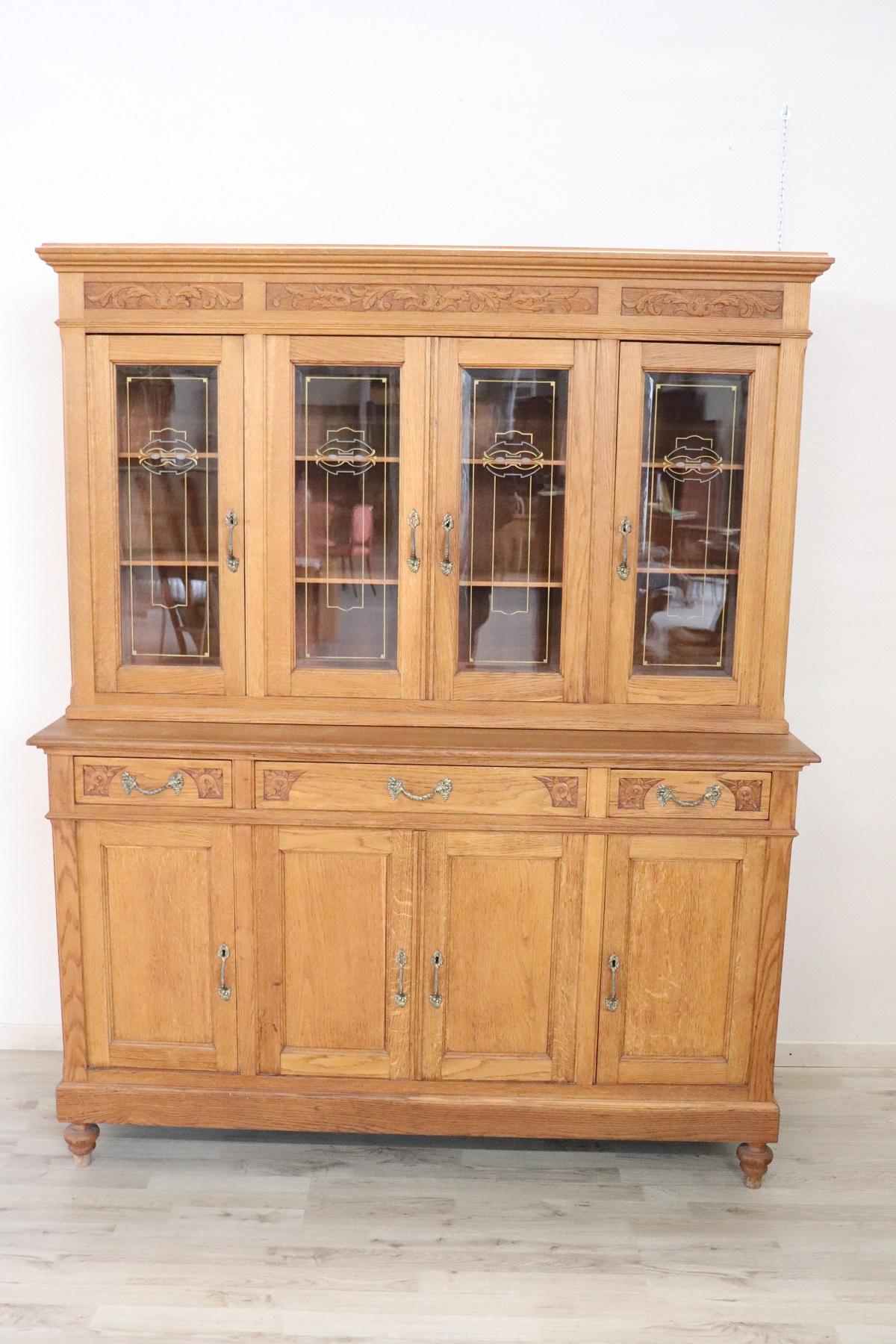 Rare antique 20th century Italian Art Nouveau dining room set 8 pieces:
An sideboard with vitrine
An extendable table
Six chairs

Beautiful dining room complete Italian chestnut solid wood very robust and durable. A beautiful sideboard in the