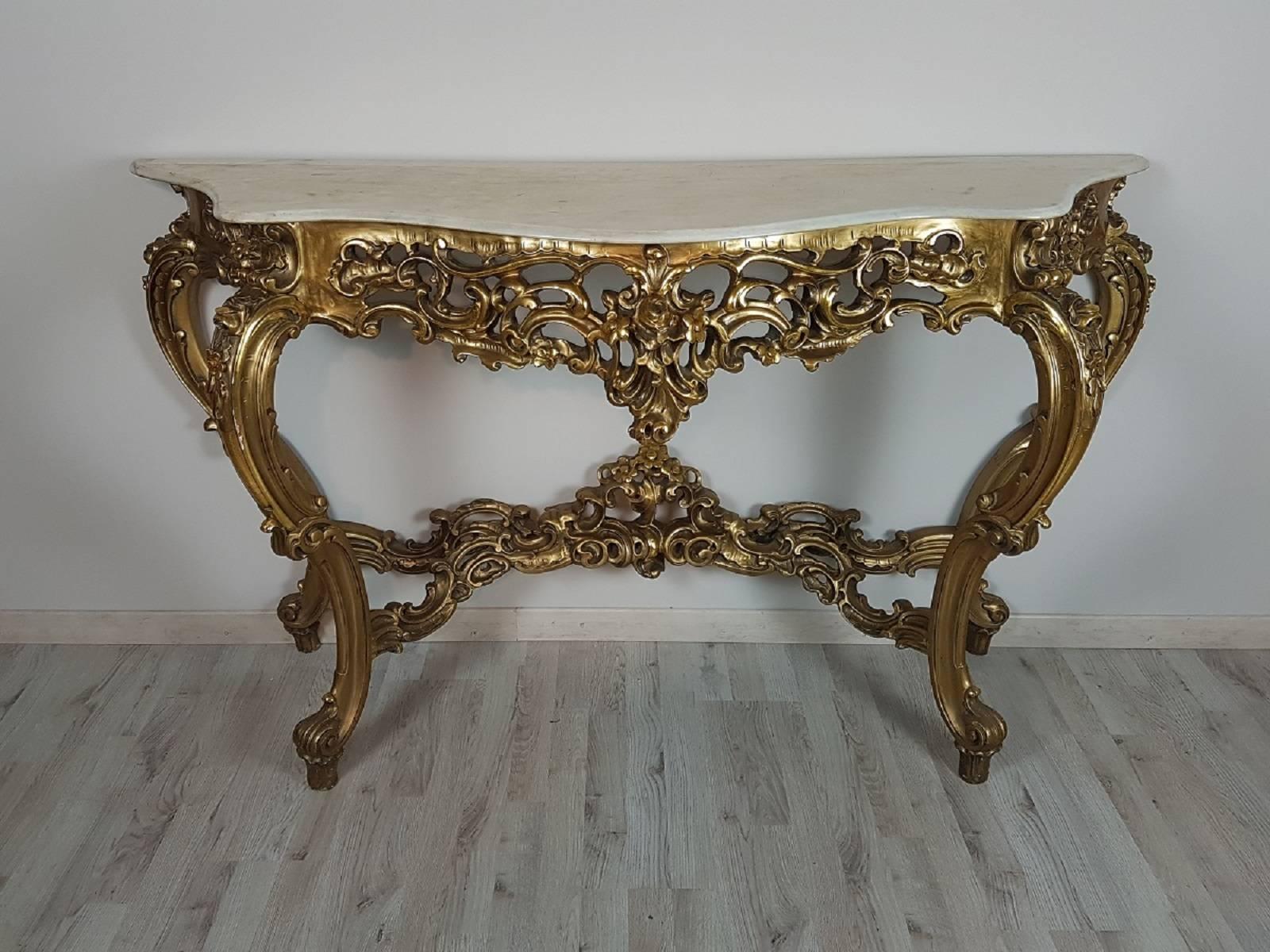 Very important beautiful rich and unobtainable console table with richly carved in perfect style Italian Baroque.
The console table was built in the early 1900s beautiful workmanship in gold and marble
The console comes in fact from a noble