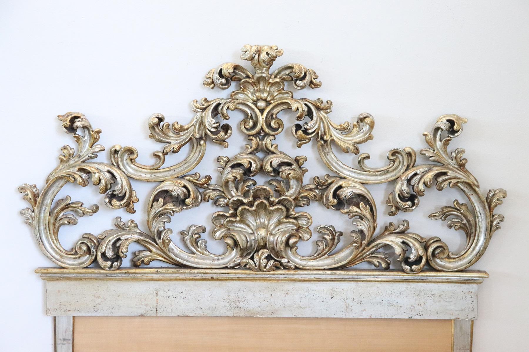 Italian Baroque style double bed. Rich carved gilded and silvered wood. Great woodwork with lots of curls and swirls of typical Italian Baroque taste. The measurements shown are external.