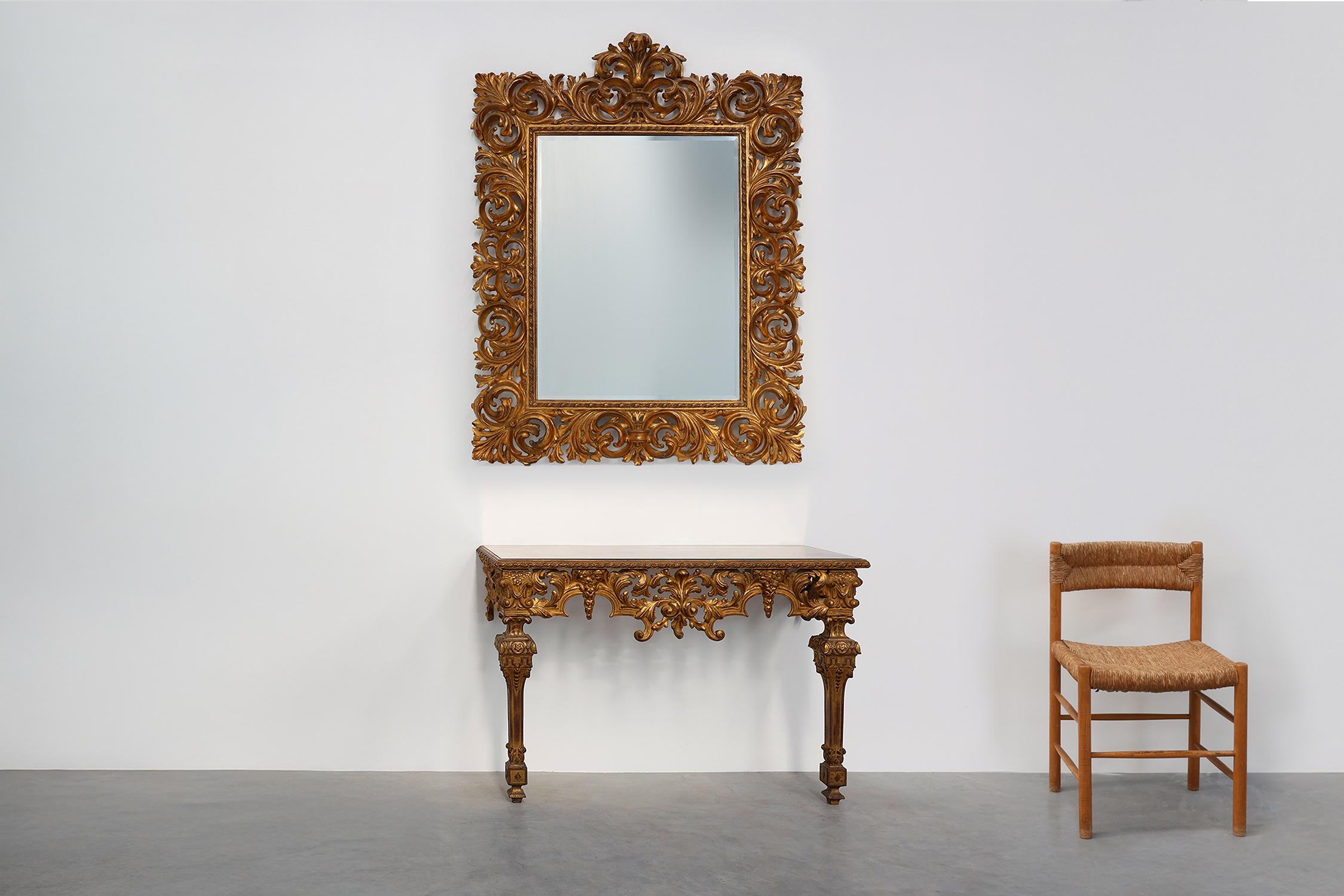 
Belgium / 1950 / Console / Resin, fume mirror / Baroque / Italian / Mid-century

Richly decorated Italian Baroque style console table with gilded resin frame and fume mirror top. This console features a sturdy but elegant gilded frame with baroque