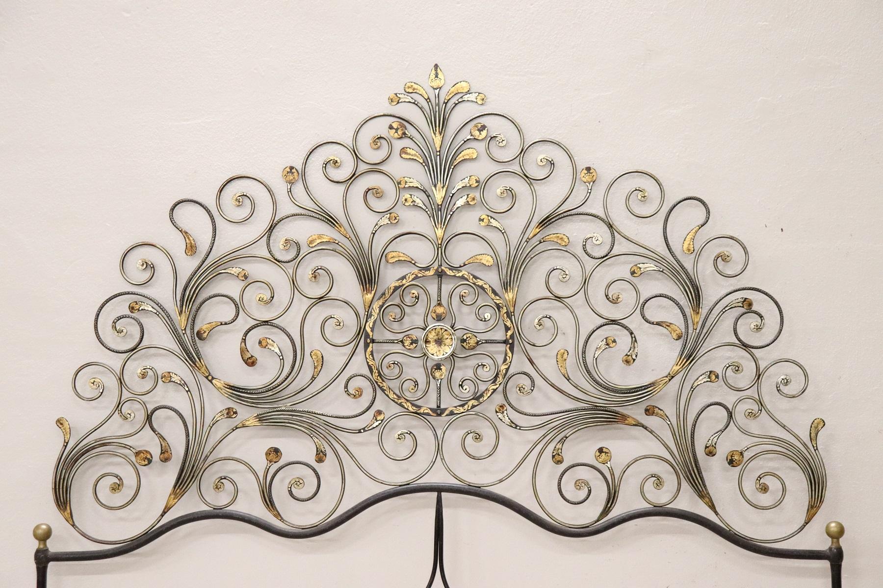 Italian Baroque style bed frame. Rich double bed headboard in gilded wrought iron. Great woodwork with lots of curls and swirls of typical Italian Baroque taste. This type of beds in Italy were typical of the city of Genoa and were called peacock