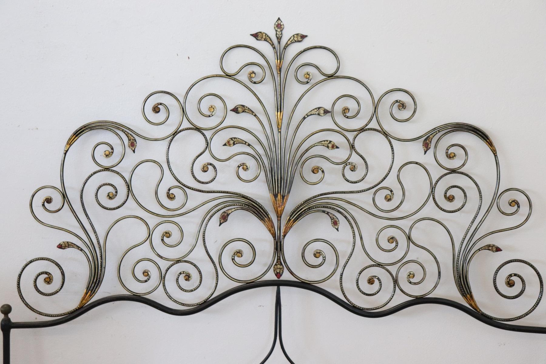 Italian Baroque style bed frame. Rich double bed headboard in gilded wrought iron. Great woodwork with lots of curls and swirls of typical Italian Baroque taste. This type of beds in Italy were typical of the city of Genoa and were called peacock