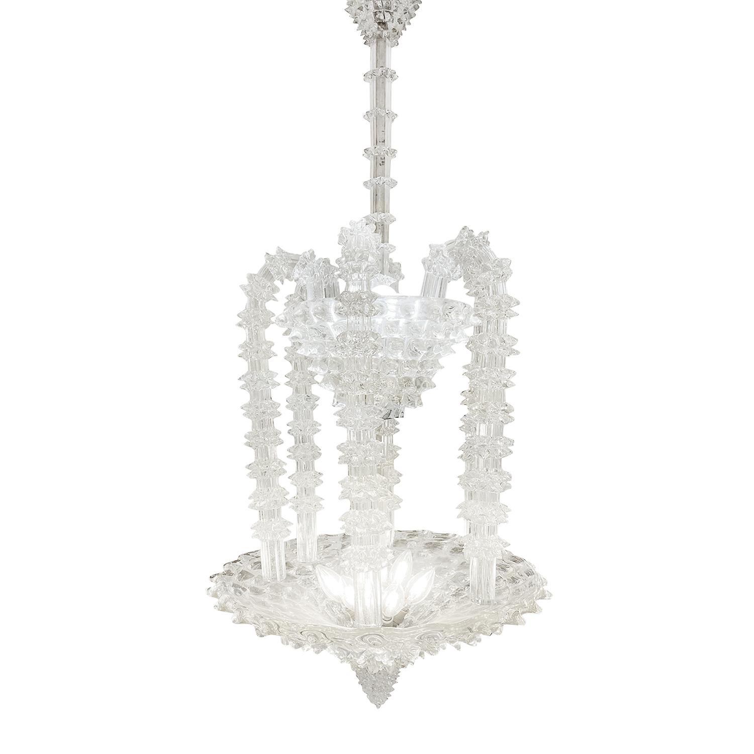A vintage Mid-Century Modern Italian chandelier made of hand blown smoked Murano glass, designed by Ercole Barovier and produced by Barovier & Toso in good condition. The detailed tall, round pendant is composed with six twisted drops which are