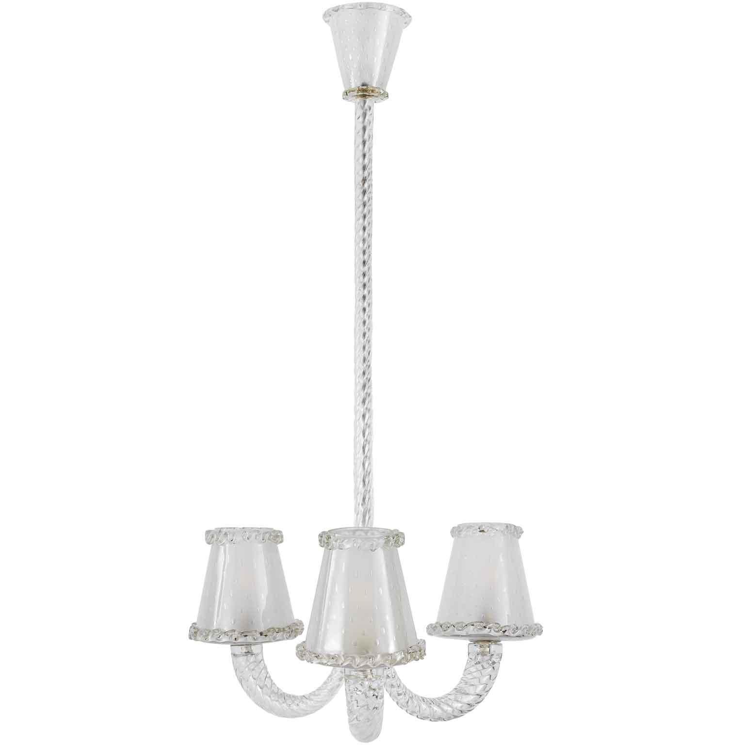 Lovely Italian Venetian Murano glass chandelier, a fashinating Art Deco Barovier Toso style pendant featuring three curved arms ending full form glass shades with applied glass trim, suitable for three light bulbs inside. 
This Venetian blown clear