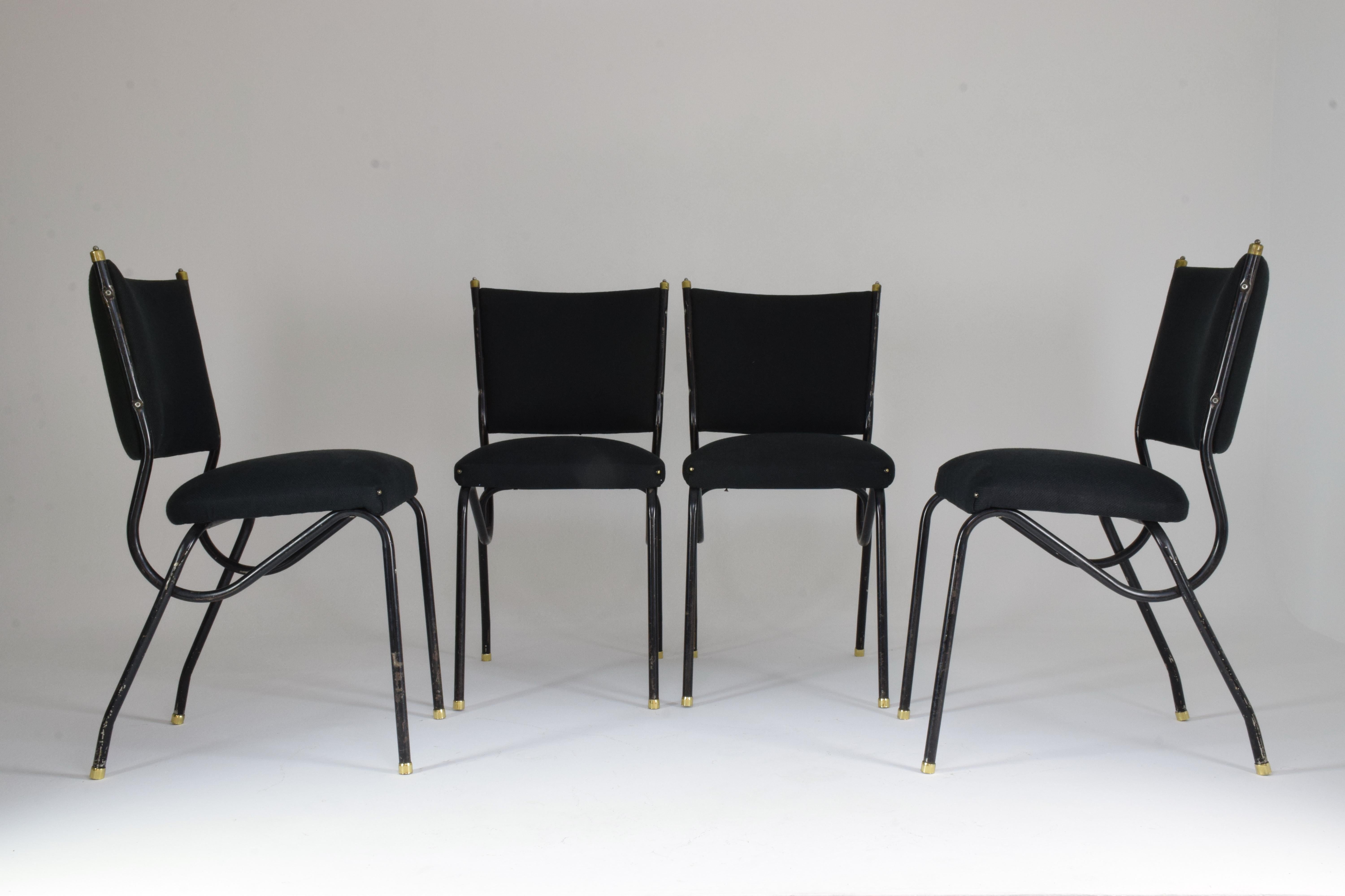A beautiful set of five Mid-Century Modern dining chairs designed in curved black lacquer tubular steel with a brass detailed structure by Studio BBPR circa 1950s.
The upholstery is entirely restored in black fabric, the structure has been purposely