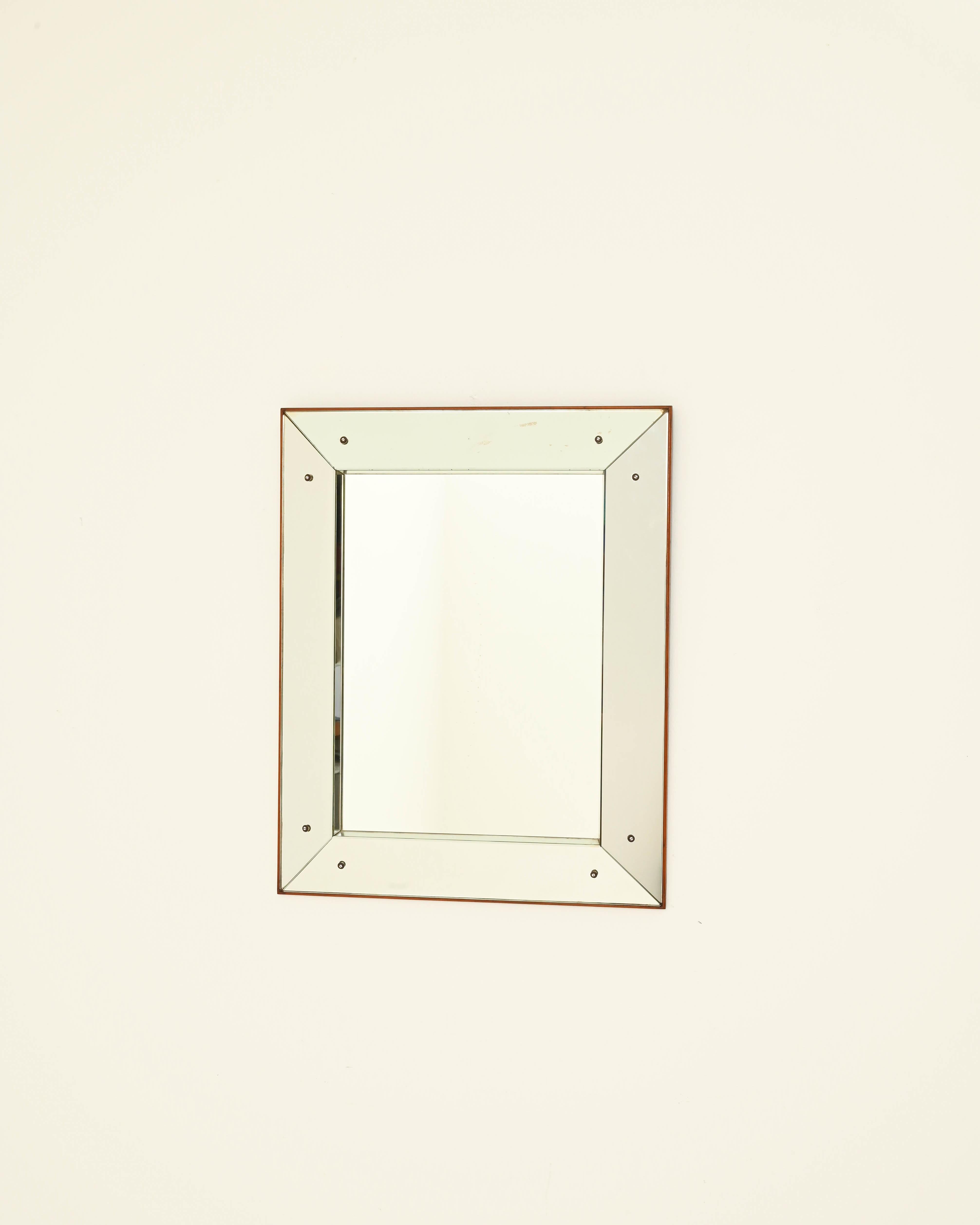 A keenly stylish design gives this vintage mirror a timeless glamour. Made in Italy in the 20th century, the bold minimalism and sleek unity of the composition showcase the sophistication of the ‘Bel Design’ movement. The rectangular mirror is