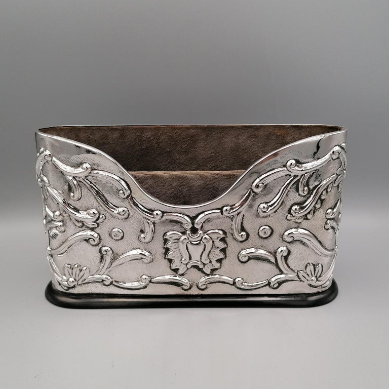 Large, completely handmade, sterling silver envelope holder 
Perfect for a prestigious desk.
The pen holder is embossed by hand on both sides with scrolls and floral motifs
Wooden base

By Goldsilver Fani - Florence - Italy
for Arval Argenti