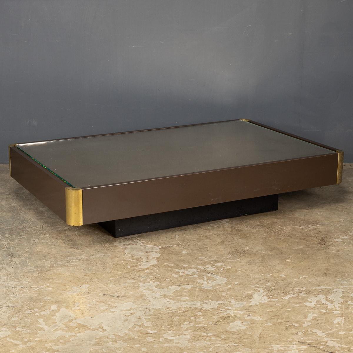 A low coffee table by Wlliy Rizzo in a lacquered finish with a glass top over a brass panel and brass corner detail. A stylish and wonderful addition to any contemporary interior looking to add a quirky finish with a simple yet useful retro item of