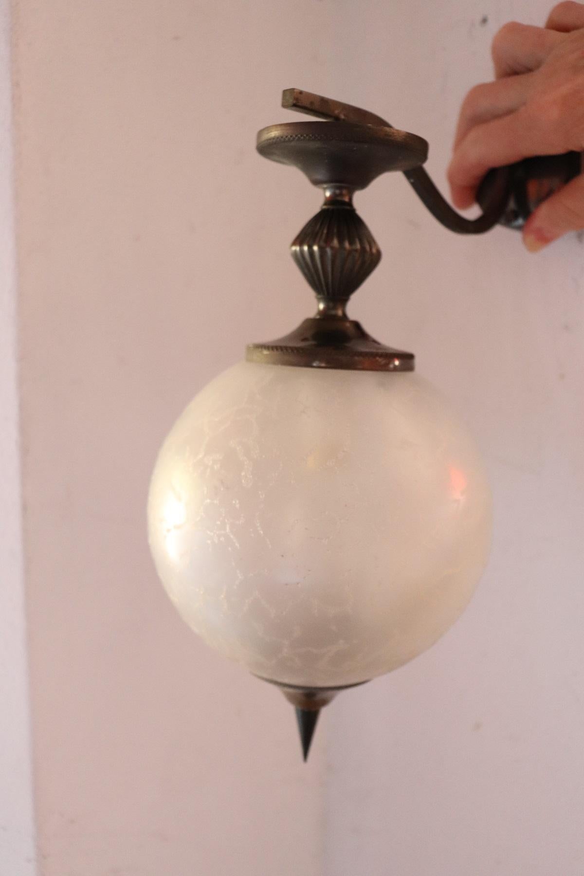 Beautiful and refined Italian pair of wall light or sconce one light. Made in bronze with large bowl in glazed and decorated artistic glass. Very decorative and large perfect for your wall.