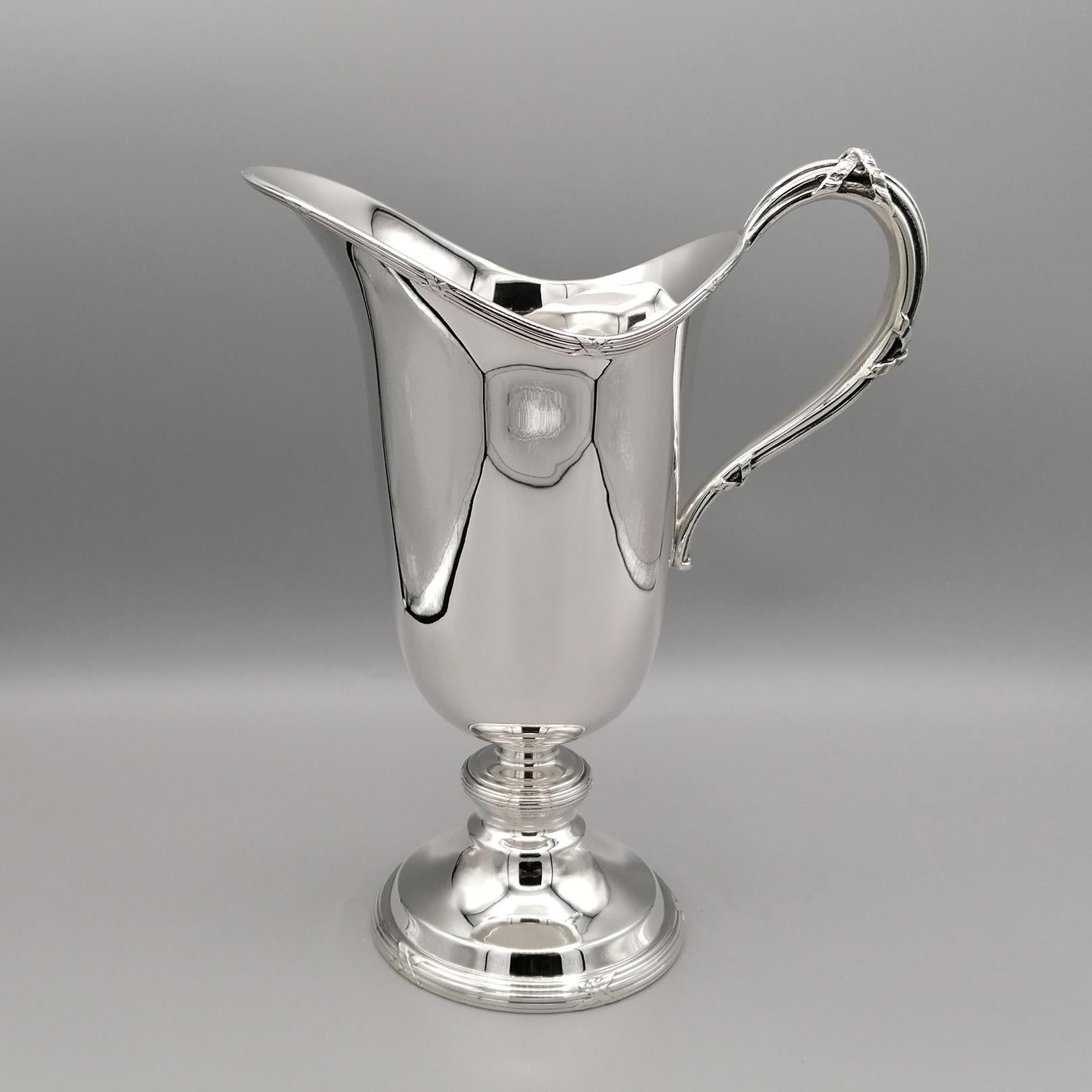 Italian Louis XVI style sterling silver carafe made by Gianmaria Buccellati.
The body of the carafe is smooth and supported by a round base with a Louis XVI edge.
The edge with cross ribbon characterizes the Classic Luis XVI style has also been