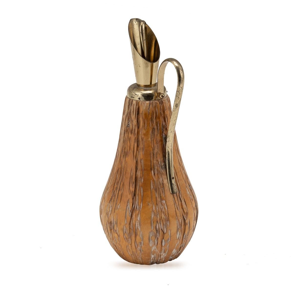 An Aldo Tura wood flask crafted for Macabo, Cusano Milanino, made in Italy around the 1960s. This exquisite piece reflects the distinctive style of Aldo Tura, a renowned Italian designer known for his innovative and luxurious creations. The carved