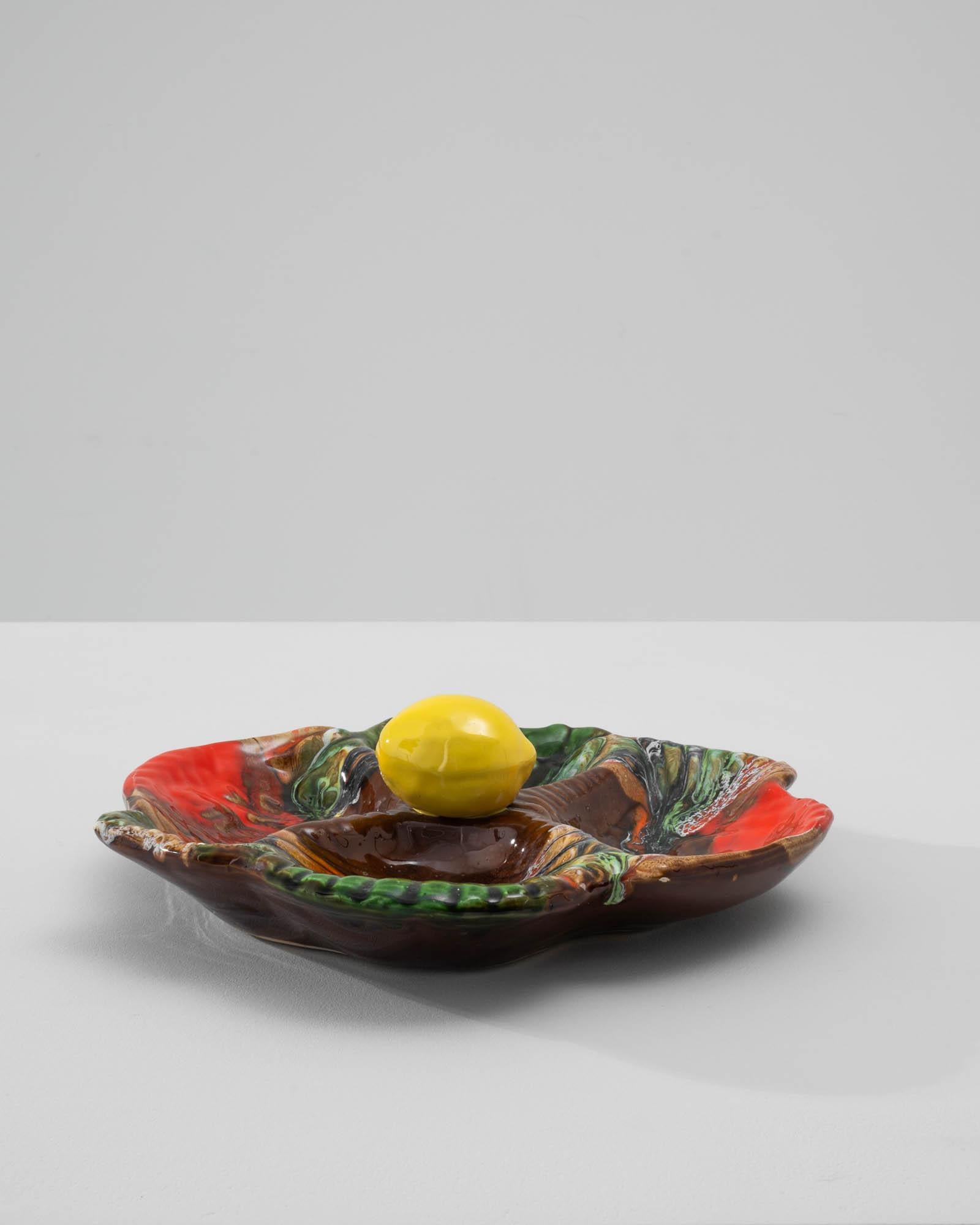 Elevate your dining experience with this exquisite 20th Century Italian Ceramic Platter, a harmonious blend of functionality and artistry. The platter boasts four equal indents strategically placed at each corner, providing a perfect space for you