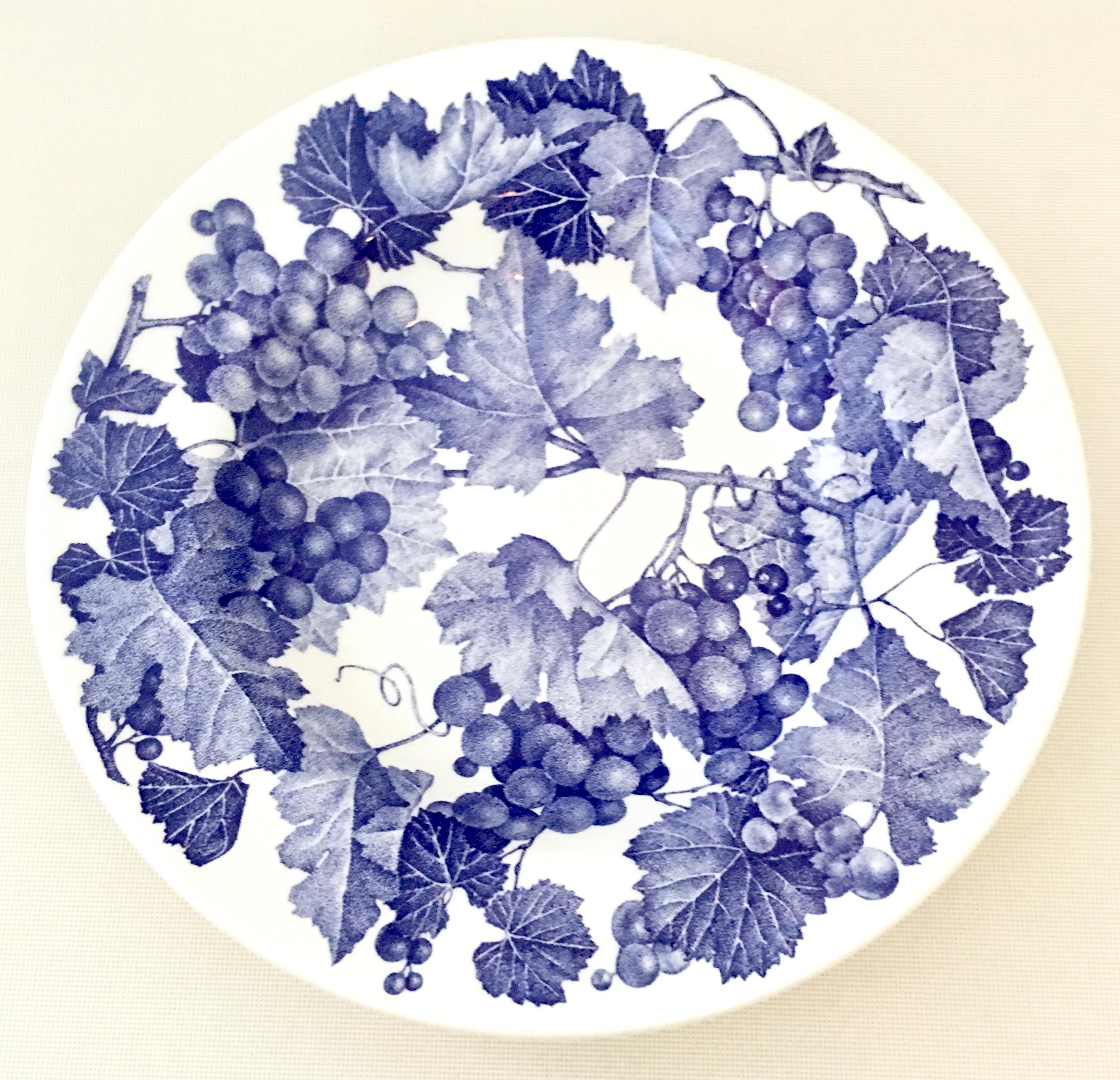 20th century Italian ceramic pottery rim soup bowls by, La Primula set of six pieces. Features a bright whit ground with ink blue grape vine pattern. Each pieces is signed on the underside, made in Italy.