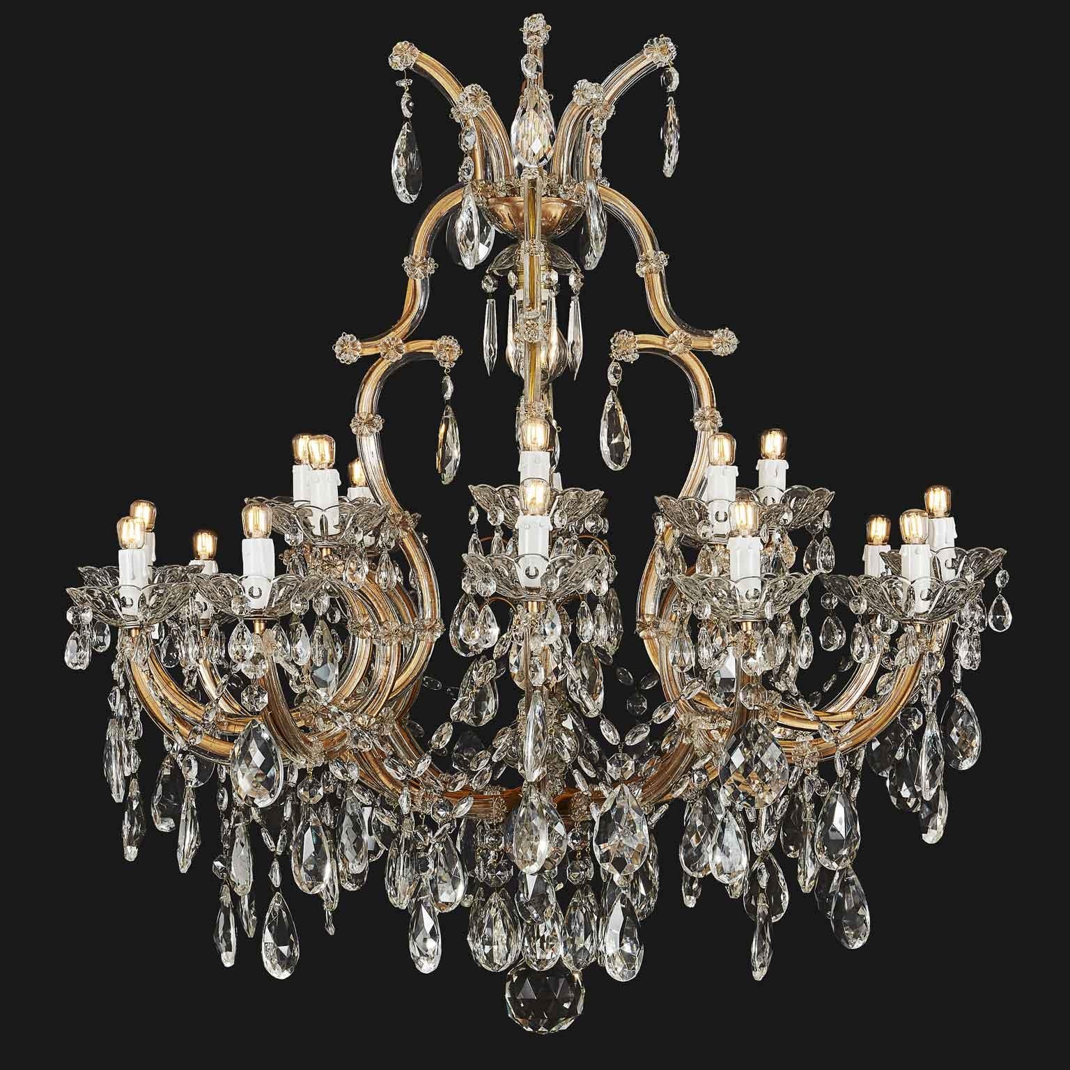 Gorgeous Italian Maria Therese style twenty one-light crystal chandelier with a tree-shaped form surmounted by beautifully contoured scrolling arms. This lovely two-tier chandelier is in good condition and comes from a private palazzo of Milano