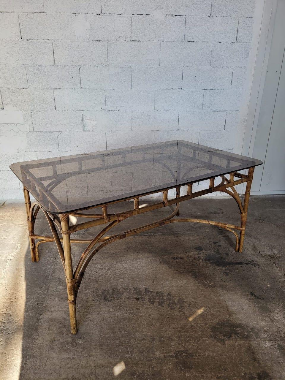 Italian mid-century rattan and bamboo dining table by Dal Vera, circa 1960.
Smoked glass table top.