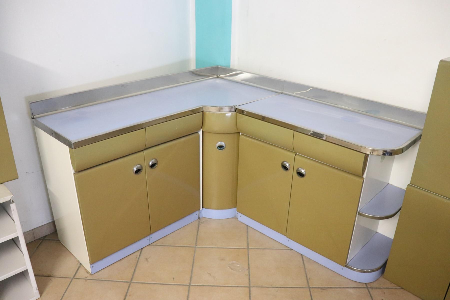 Rare 1950s Italian design modular kitchen. The kitchen consists of twelve pieces:
Three bases below
a table
two floors to fit over the bases
six wall-mounted hanging furniture
The chairs, appliances and sink are missing
This kitchen is