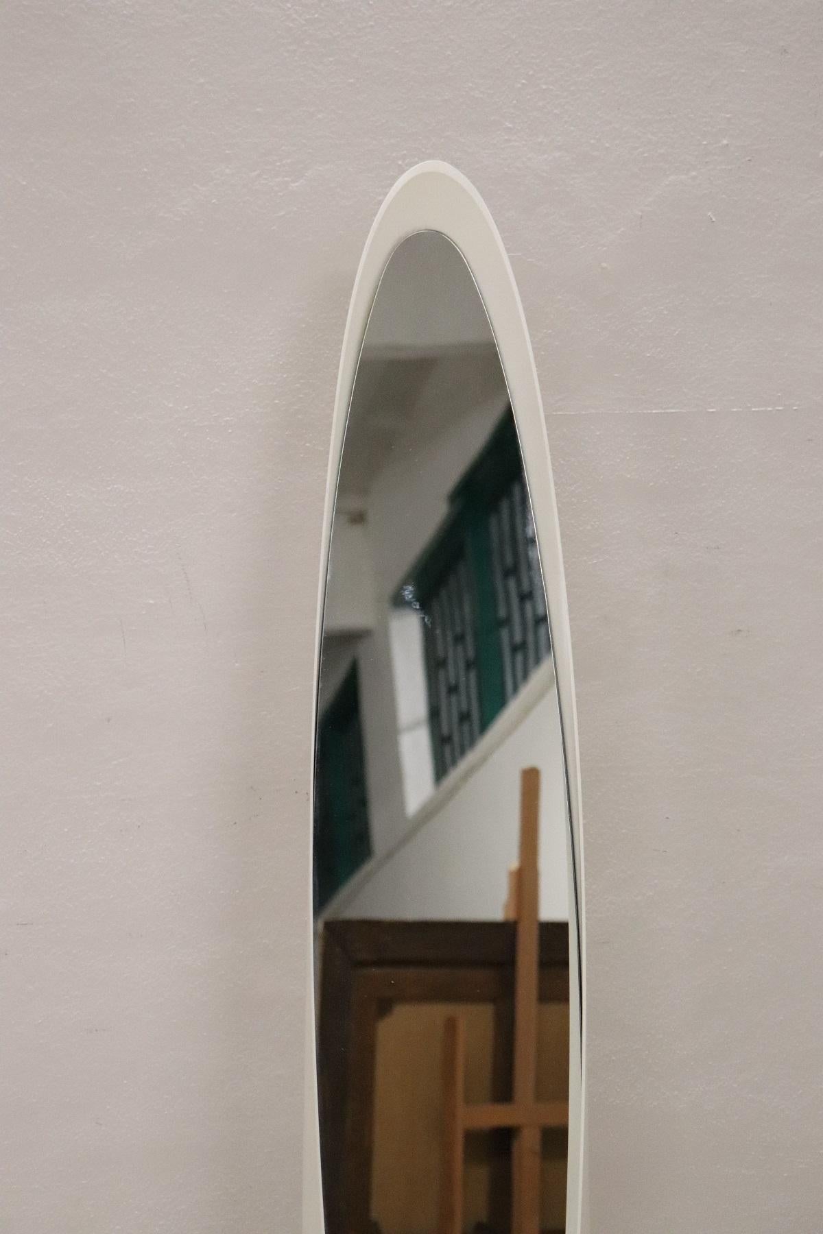 Rare Italian floor mirror in white plastic material. These mirrors became famous in the 1970s with the name of 