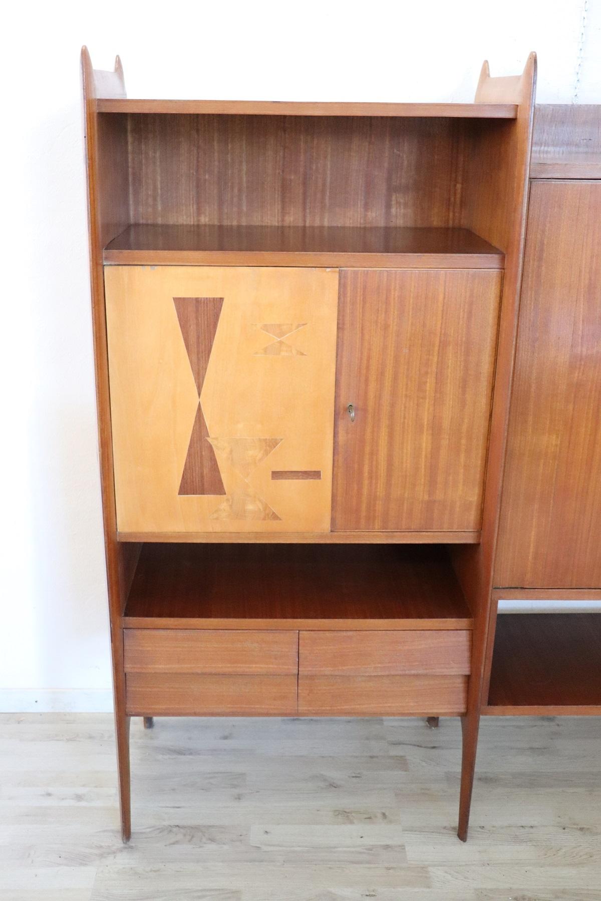 Italian design bookcase or cabinet 1960s high quality furniture. This Italian design furniture is made of teak wood and can be used in different ways. They can be practical bookcases or cabinets for the living room. The color contrast is very