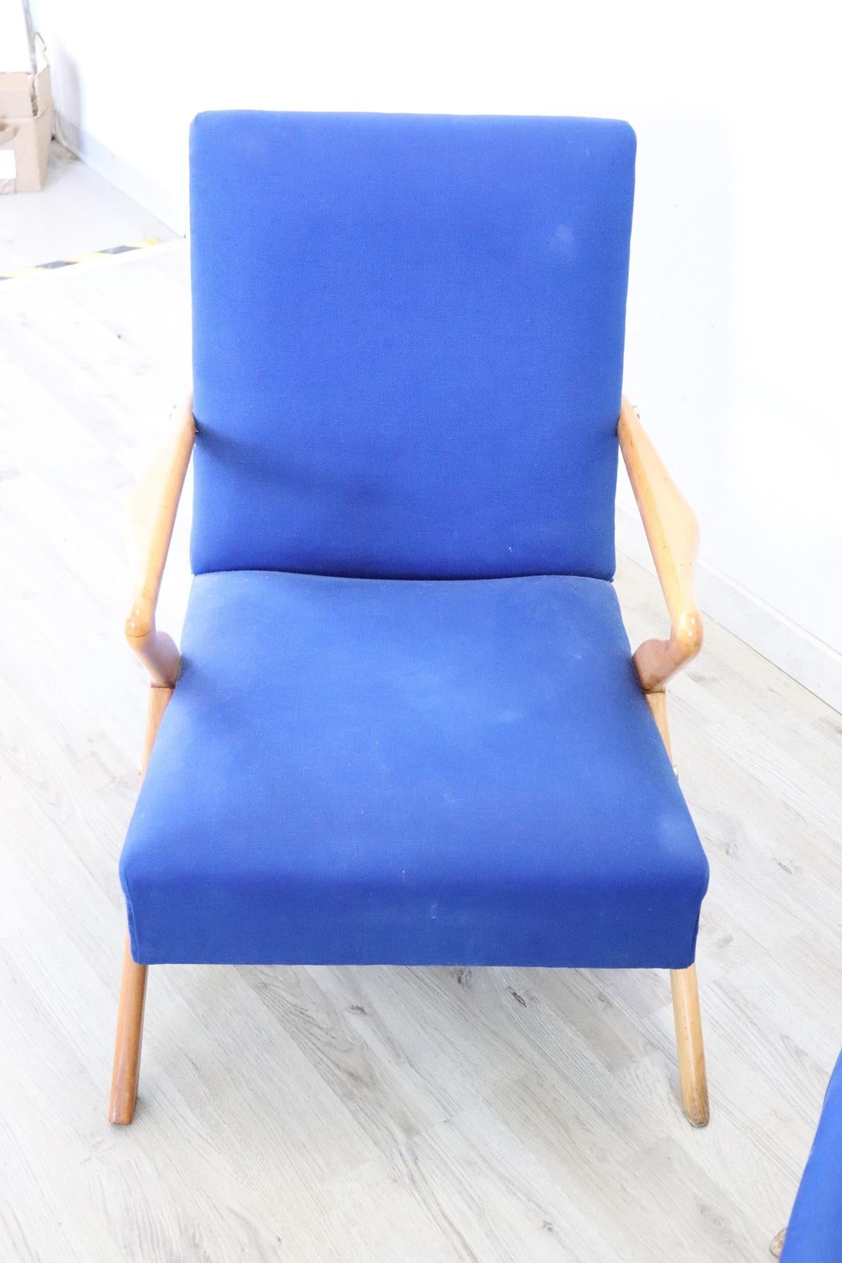 Beautiful and rare series of two Italian design armchairs from the 1950 designer Paolo Buffa. Made of beech wood fabric in blue color. True Italian design ! our design for sale is original and therefore shows traces of wear visible in the picture.