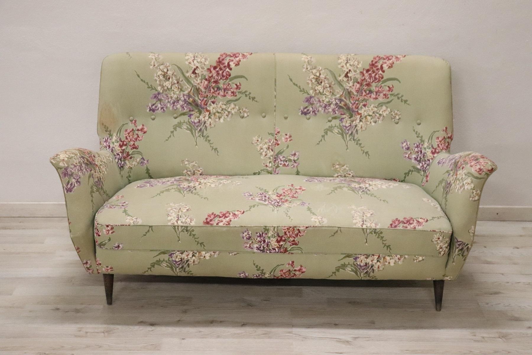 Lovely italian design sofa 1950s. Excellent condition in the wooden structure, signs of wear and stains in the fabric, replacement is recommended.