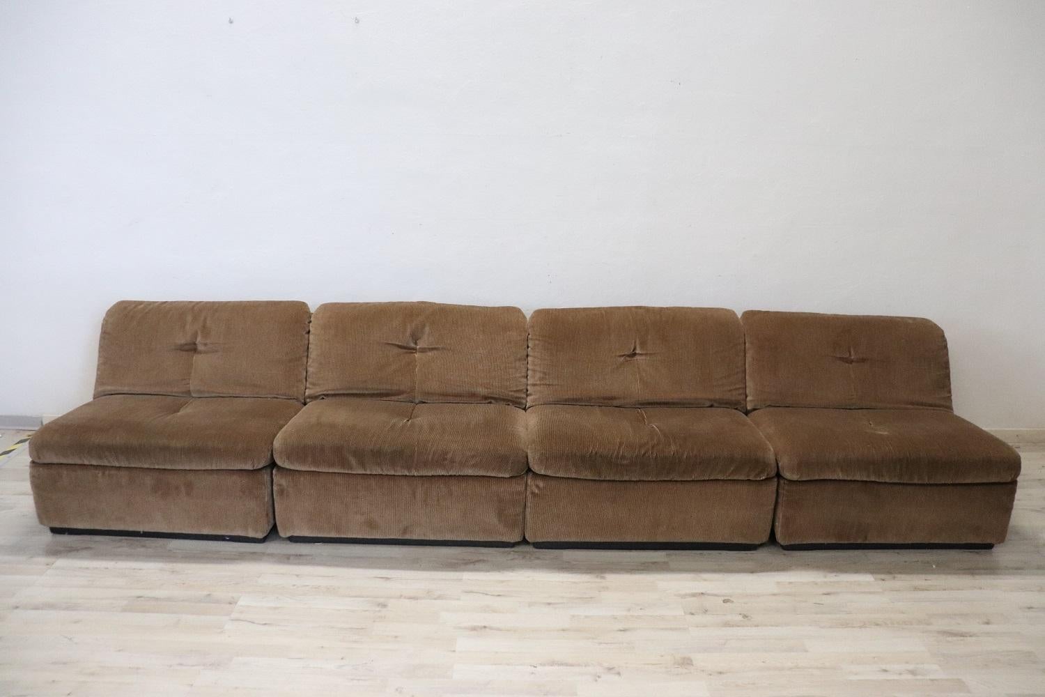 Rare Italian design modular sofa, 1970s in brown velvet. The sofa is modular and made up of four armchairs. Busnelli brand present on each armchair. The measurements indicated are for each single armchair.
 