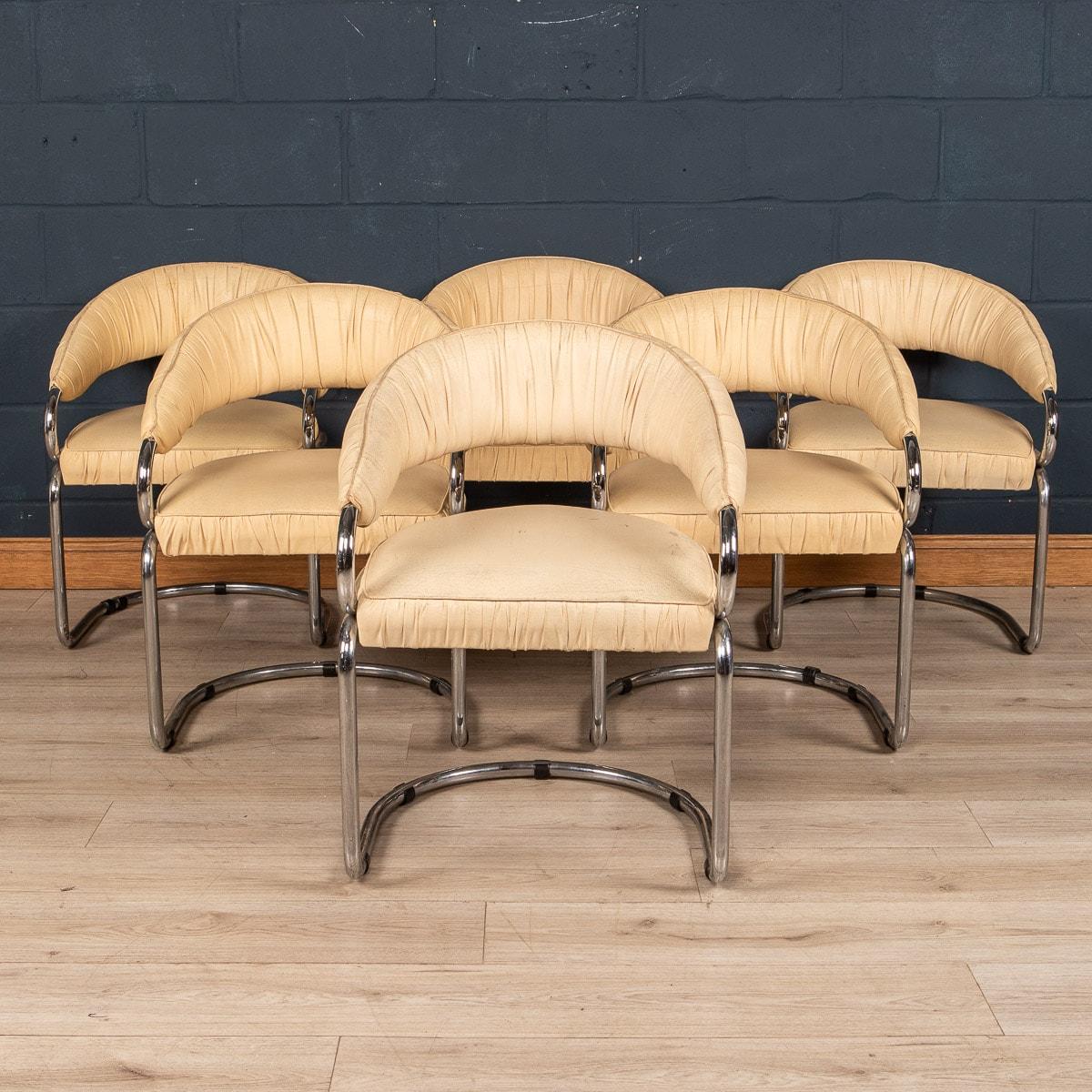 A striking set of six dining chairs designed by Giotto Stoppino for Kartell, made in Italy in the 1970s. The chairs have tubular chrome-plated metal frame, finished with a cream leather upholstery.

CONDITION
In Good Condition - Some minor