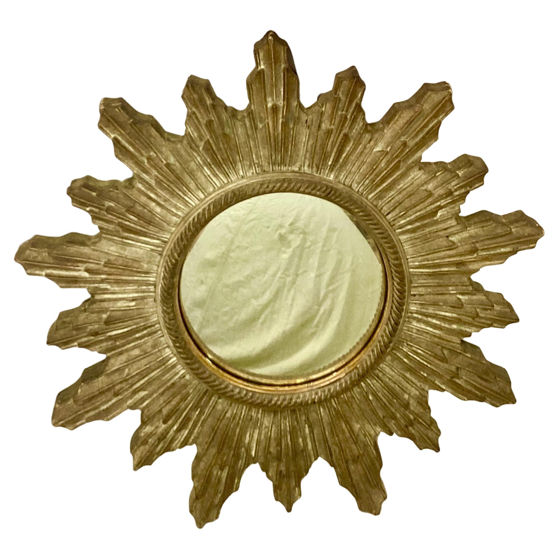 20th century Italian neoclassical sunburst wall mirror. Wonderful old patinated wooden frame. Good condition.