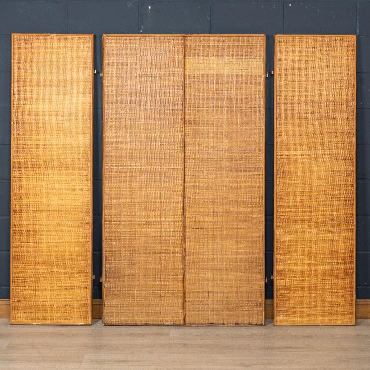 An extremely stylish bamboo room divider (or screen) manufactured by Vivai Del Sud in Italy in the 1970s. This mid century mirrored bifold screen is a statement piece which is part of Maurizio Mariani and Giusto Puri Purini's 'Palm Beach Regency'