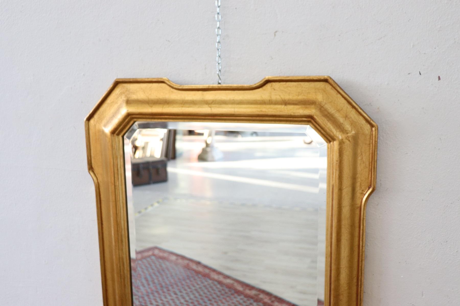 Elegant Italian wall mirror in finely gilded wood. Excellent condition ready to be inserted in your beautiful home.