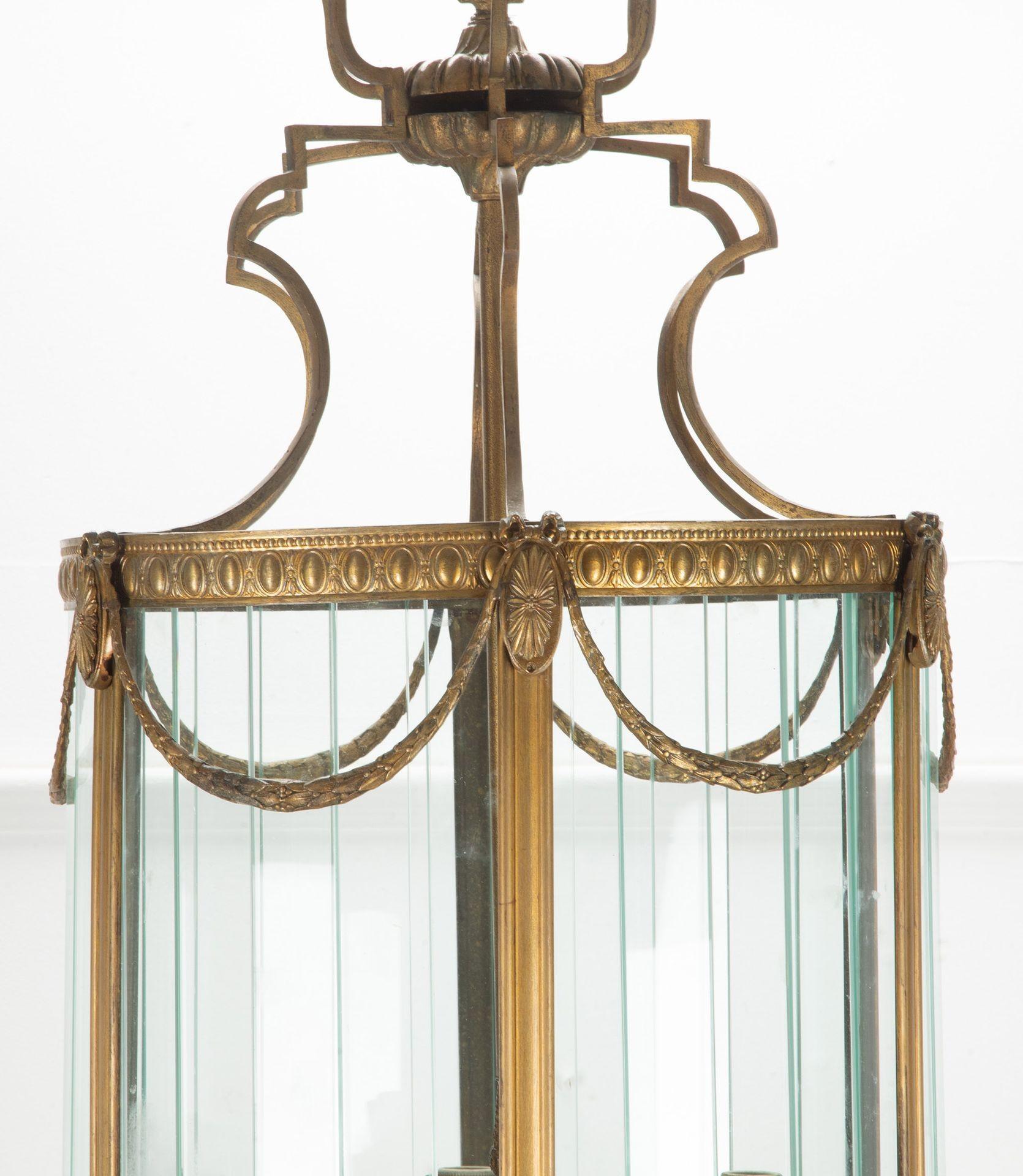20th Century Italian gilt metal lantern with centre stem.
Culminating in six candle lights and surrounded by sectional glass.
This lantern has been rewired to current UK standards.
Circa 1940.