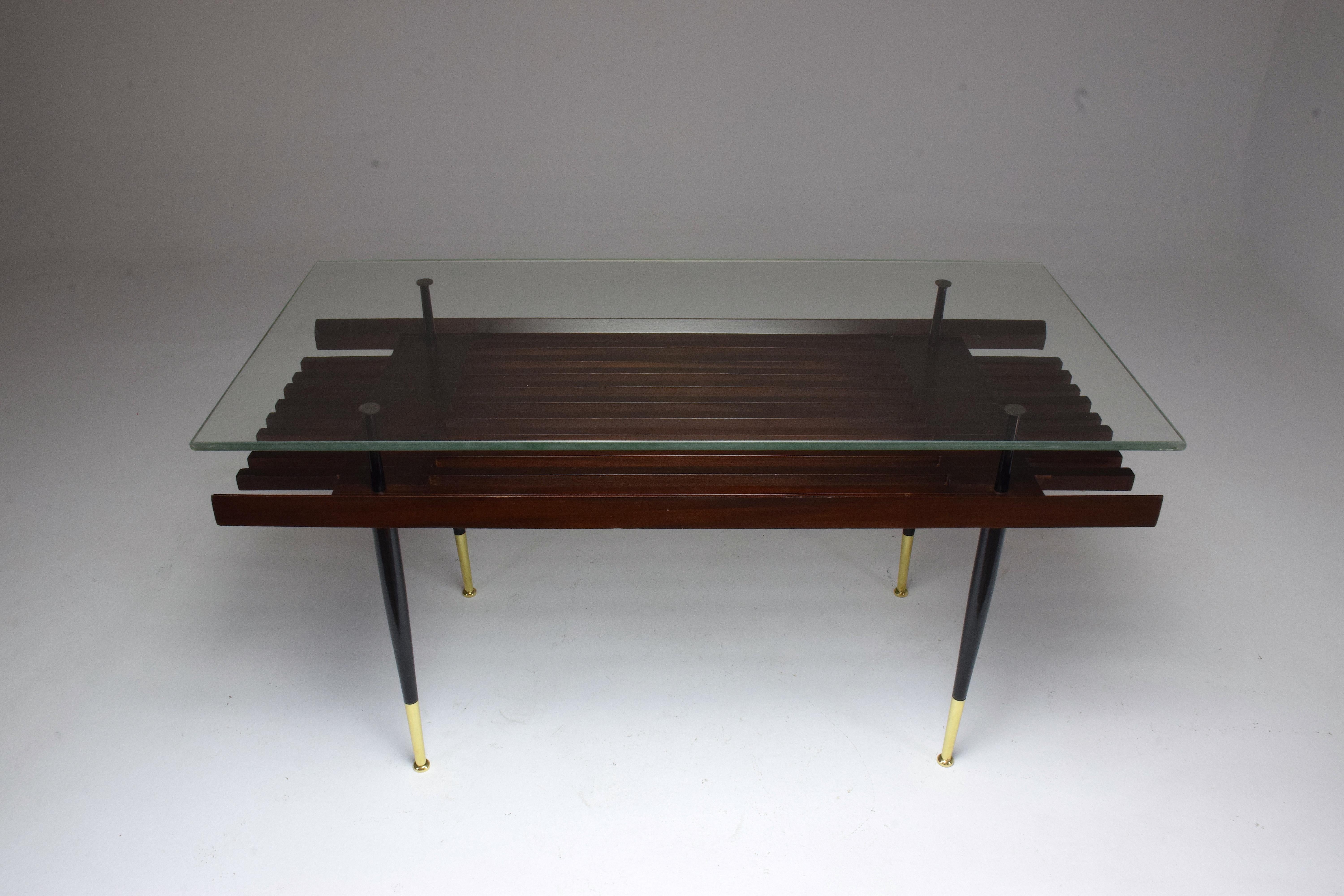 A Mid-Century Modern vintage rectangular coffee or side table with straight lacquered steel legs, polished brass endings and a clear glass tabletop.
Italy, circa 1950's.
-----
All our pieces are fully restored at our atelier and we only offer items