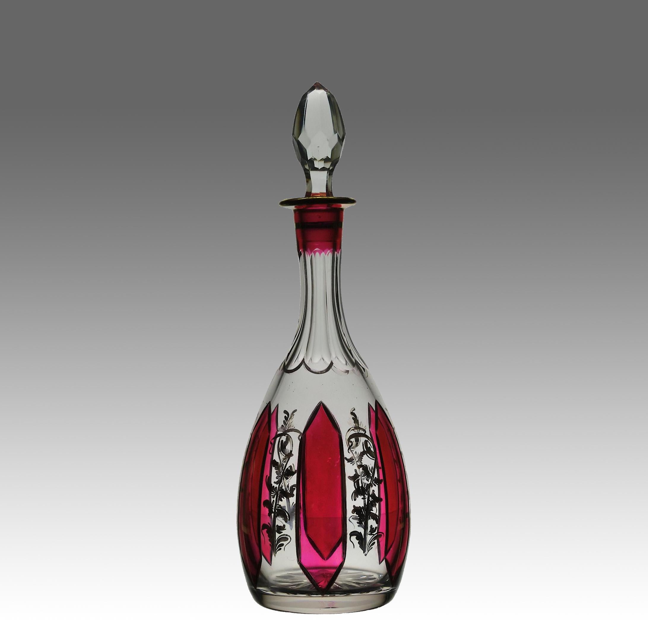 An attractive glass decanter cased in red and engraved with decorative motifs with star cut base and matching stopper

ADDITIONAL INFORMATION
Height:                                      37 cm                  

Condition:                           