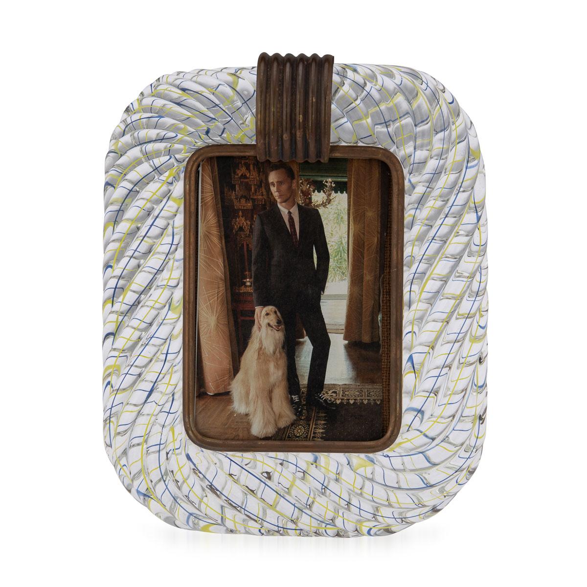 A stunning glass mounted photograph frame made by the world renowned Venini in Venice, Italy. The twisted glass rope picture frame was manufactured around the middle of the 20th century and encapsulates Venini’s philosophy of elegance and art using